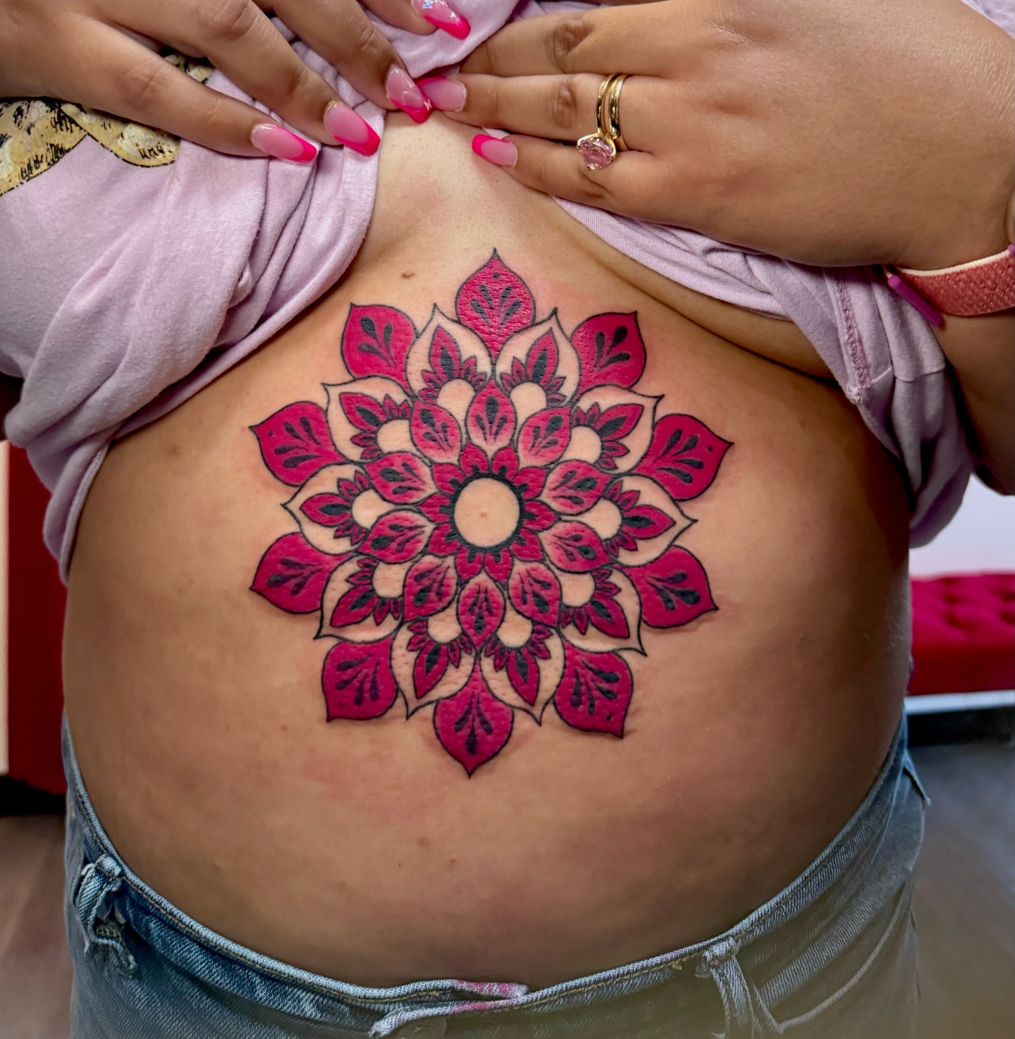 Mandala geometric tattoo on the torso by Tess