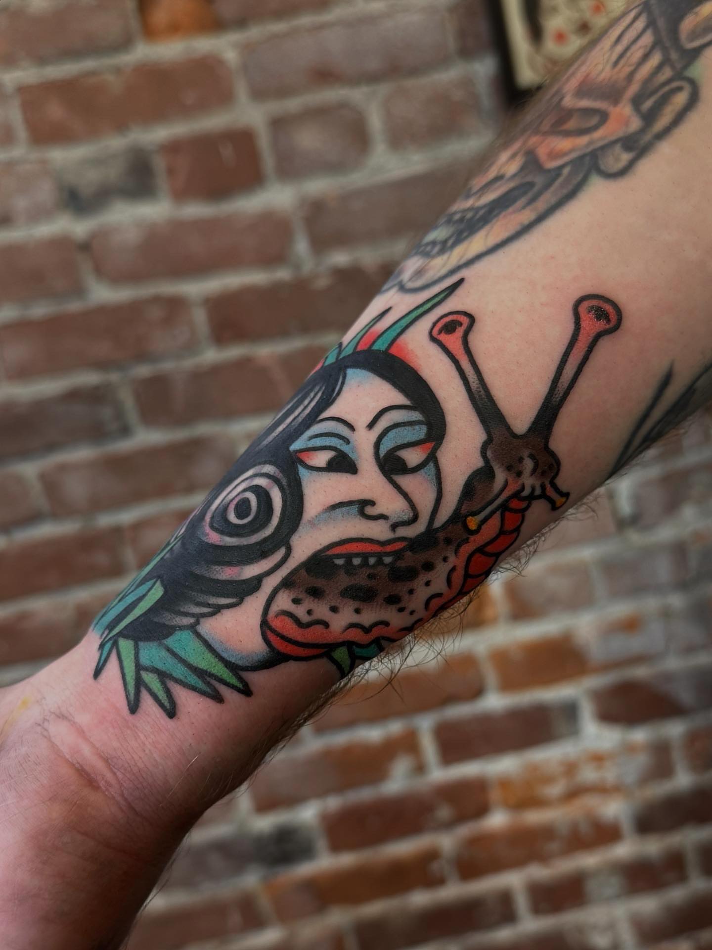 Woman with insects American traditional tattoo on the forearm by Bryce Shearer