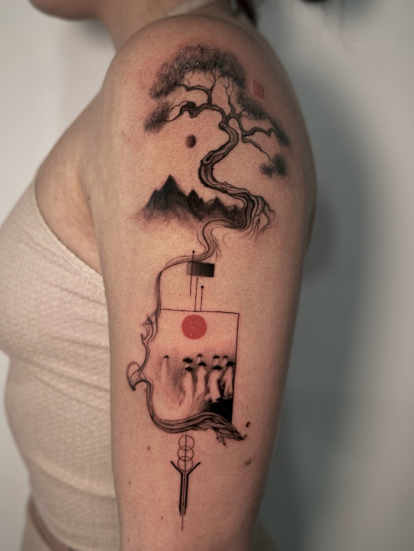 Bonsai tree and samurai helmet geometric tattoo on the forearm by Lily K.