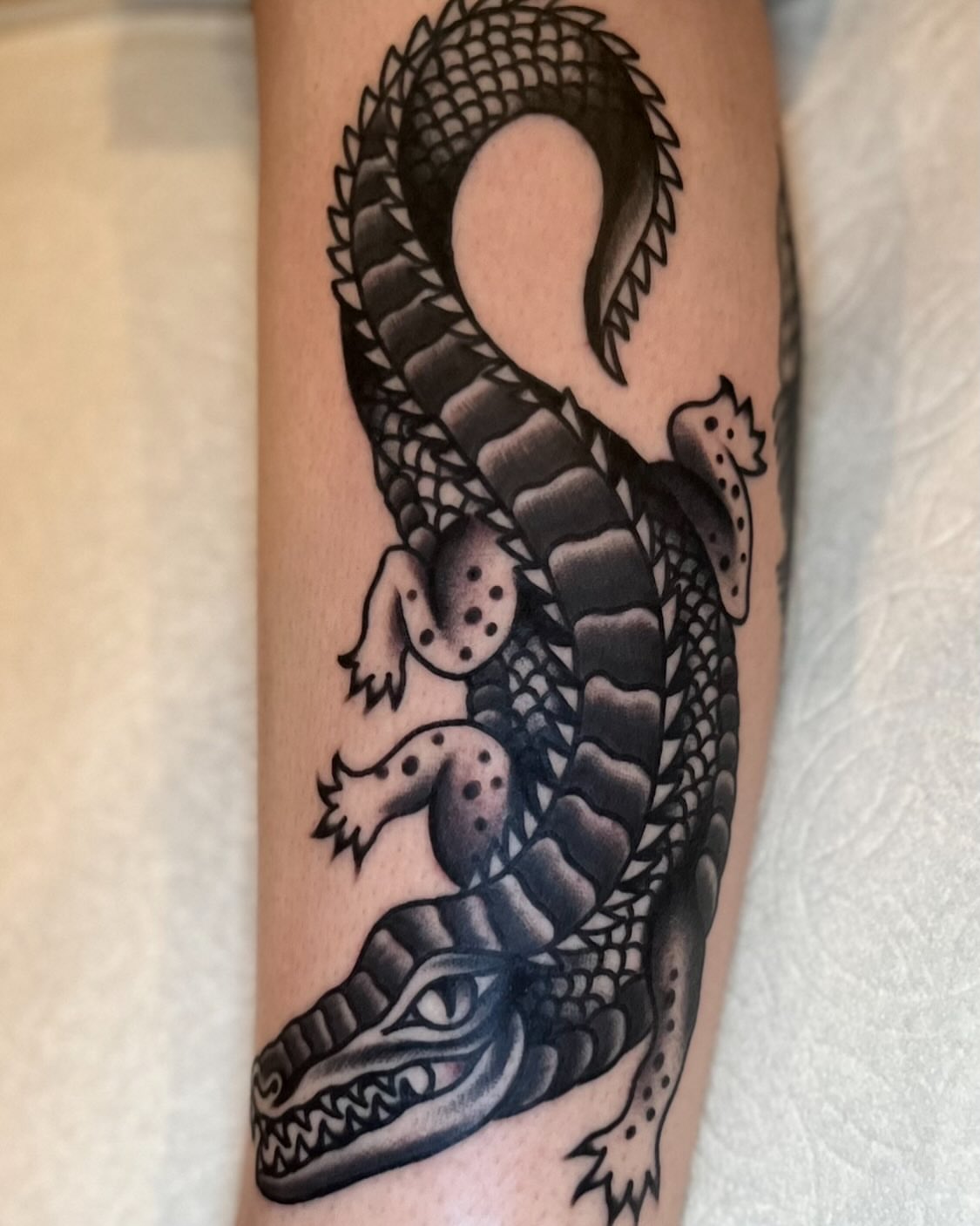 Alligator black and grey tattoo on the forearm by Eli Bernal