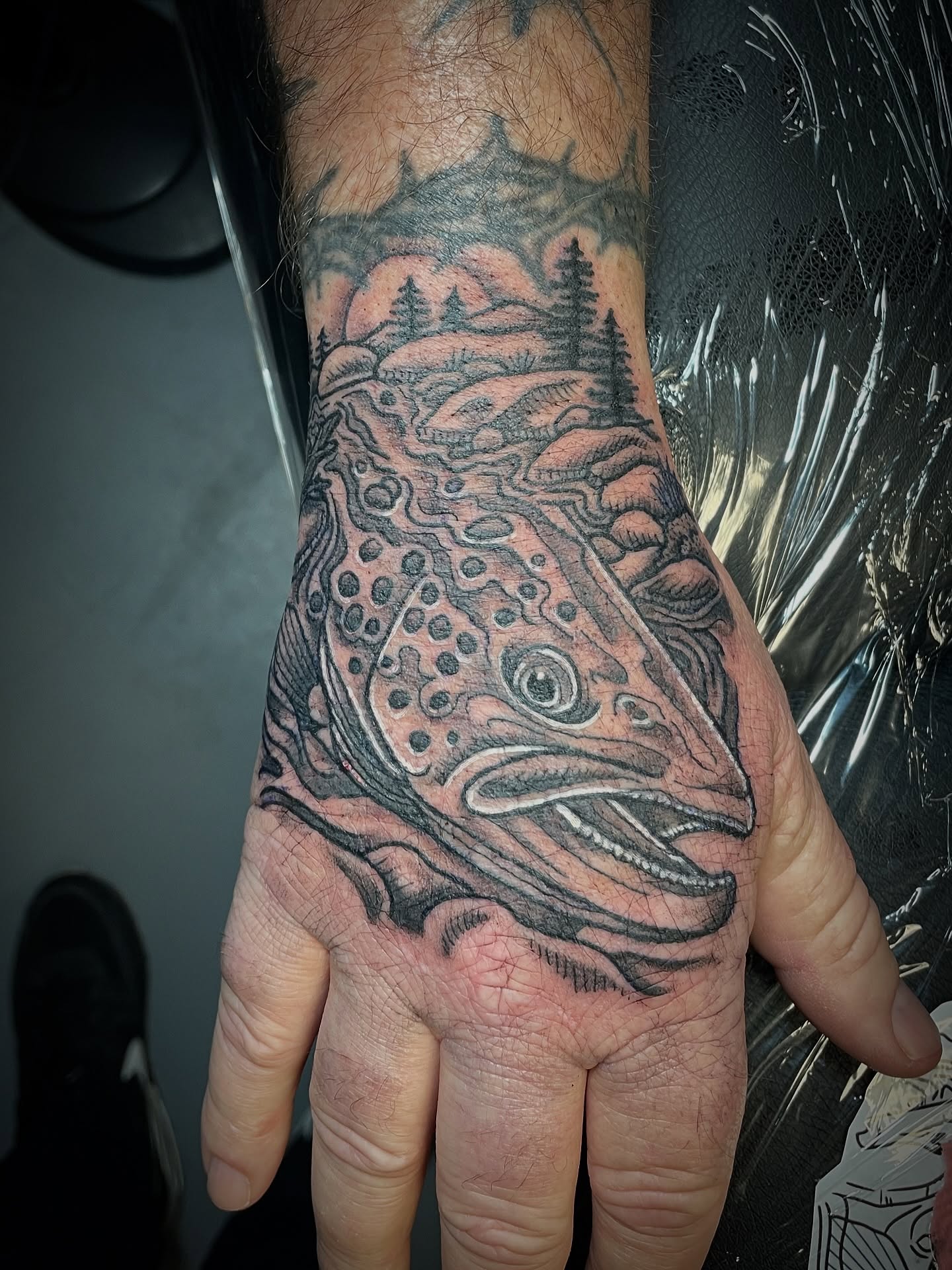 Brown trout realism tattoo on the hand by πΌπ
ππΎπππππ
