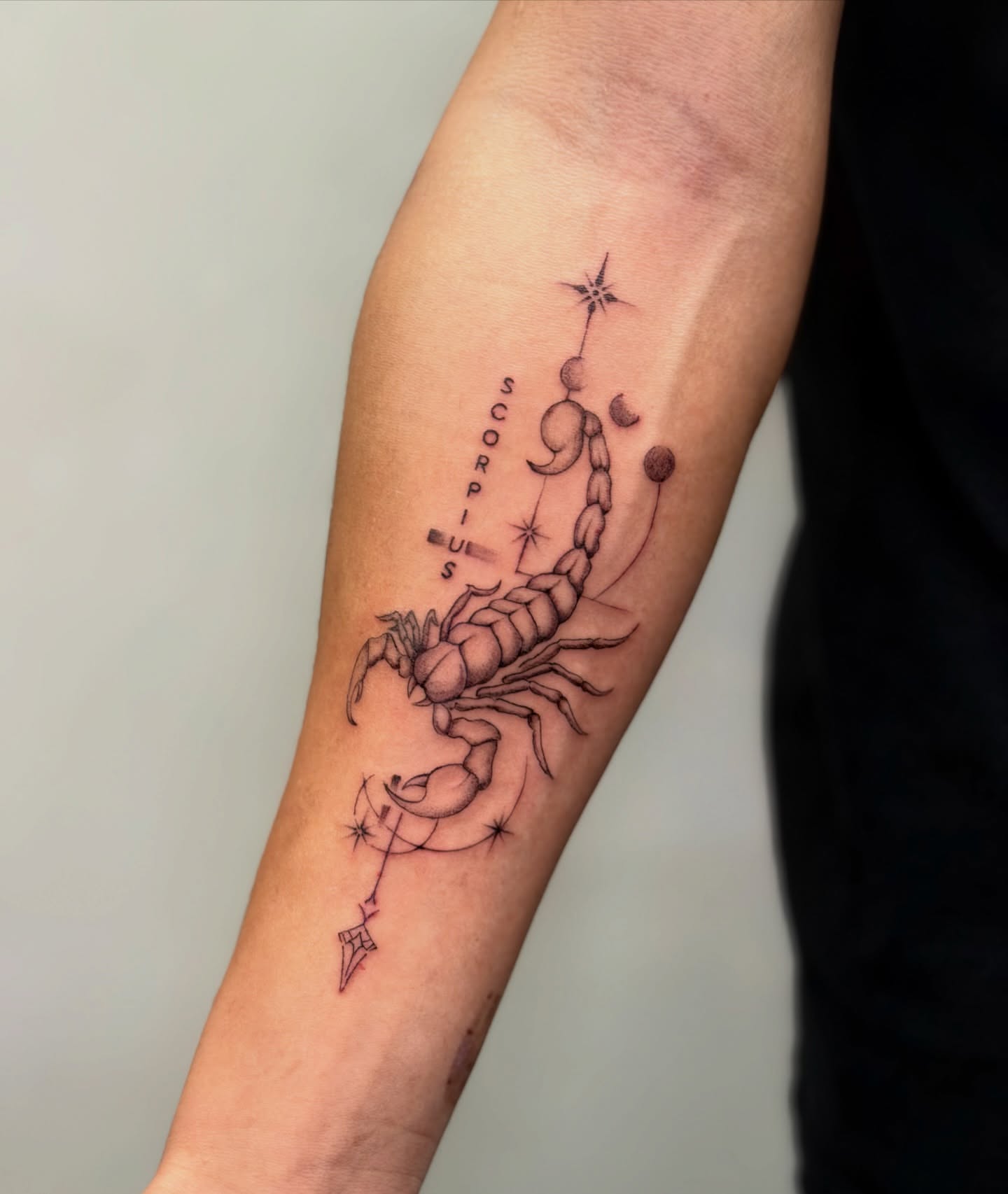 Scorpion constellation black and grey tattoo on the forearm by Bryan Nguyen