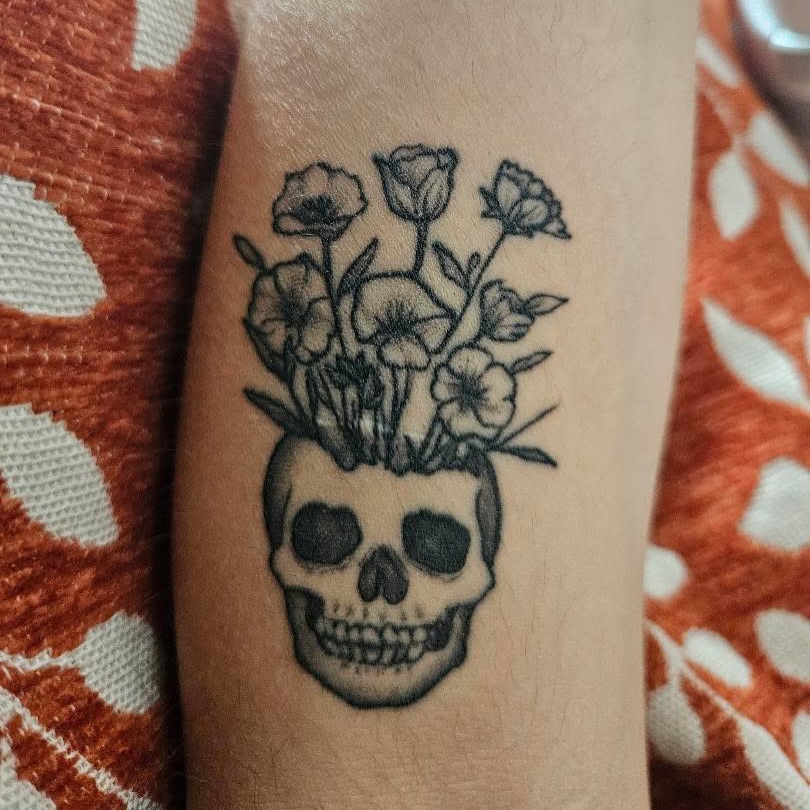 Skull with flowers black and grey tattoo on the forearm by Porshamonie' THE Tattoo ARTIST