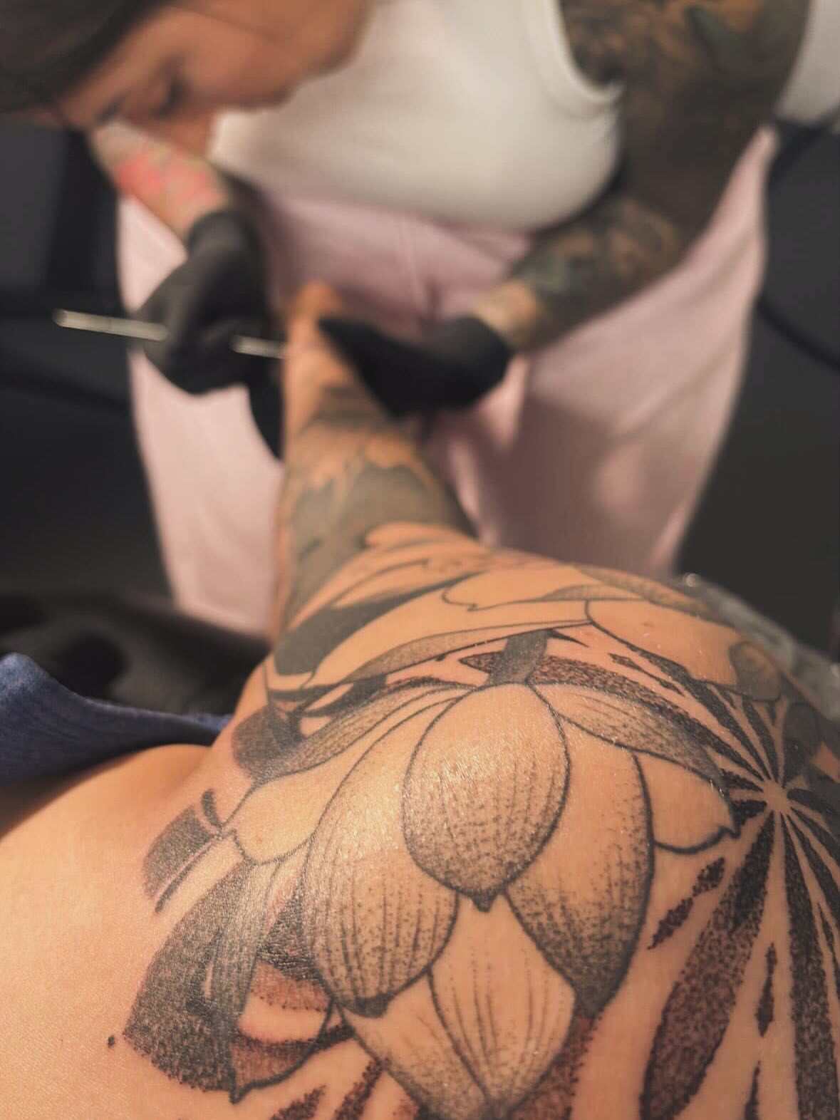 Lotus flower dotwork tattoo on the shoulder by Katherin Plaza