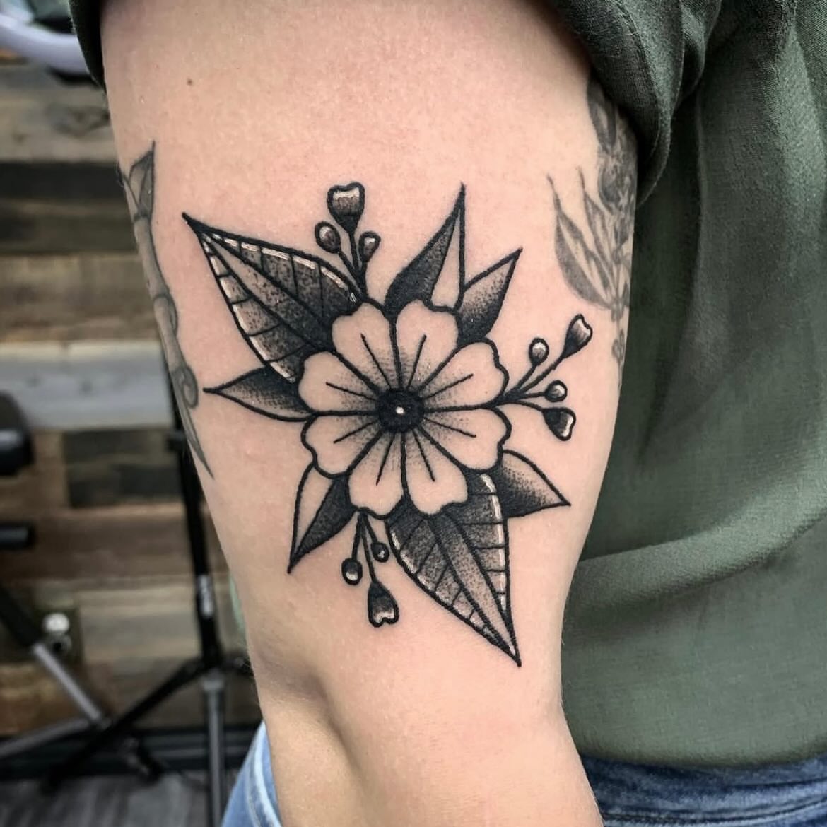 Flower black and grey tattoo on the forearm by Sean Gallagher