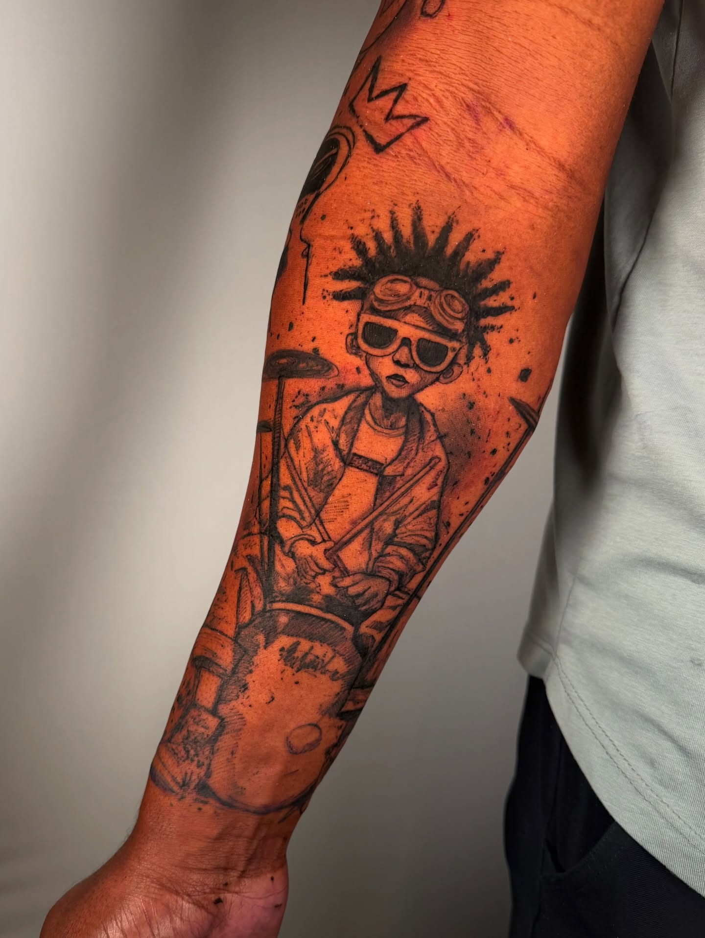 Drummer black and grey tattoo on the forearm by Georgios Papadopoulos Tattoo Artist Los