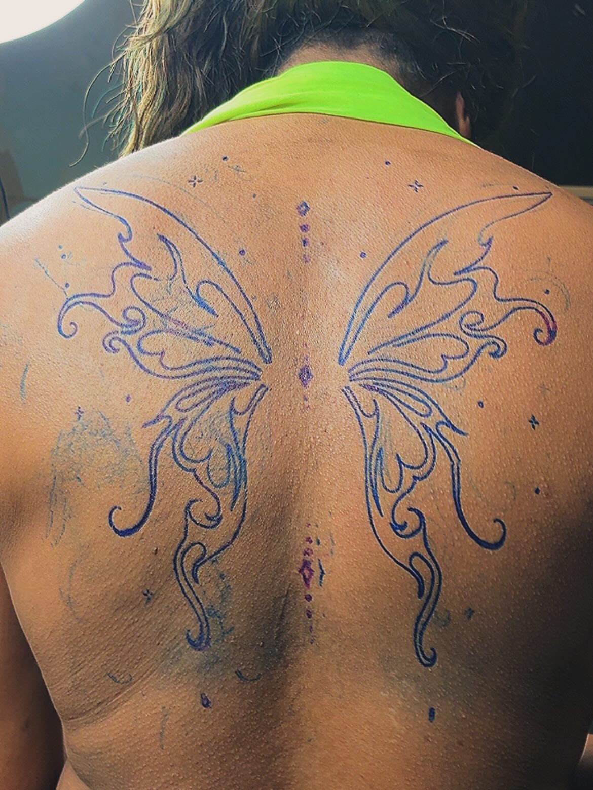 Butterfly tribal tattoo on the back by Detroit tattoo Artist