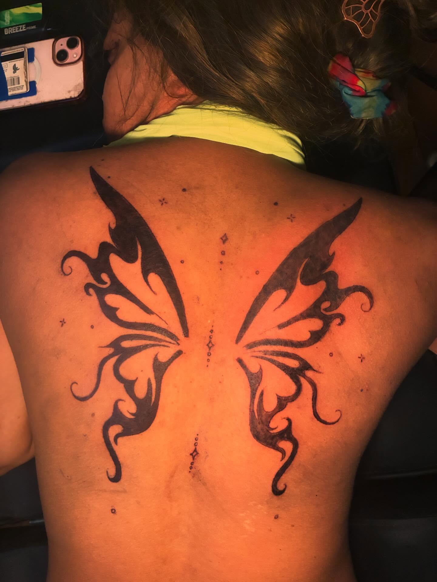 Butterfly tribal tattoo on the back by Detroit tattoo Artist