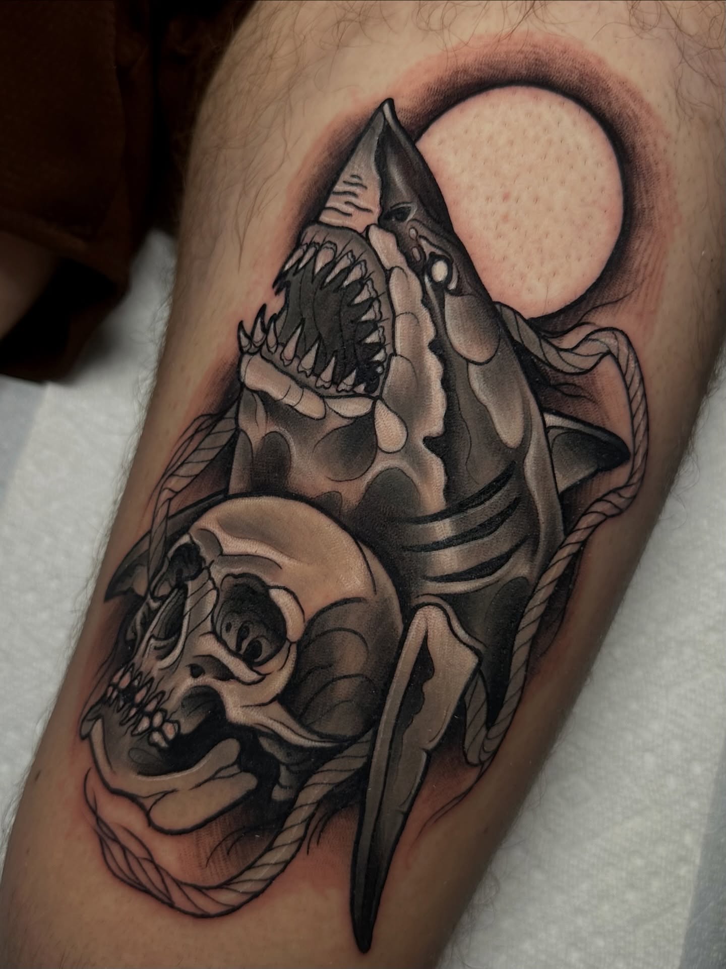 Shark and skull realism tattoo on the thigh by 𝐀𝐮𝐬𝐭𝐢𝐧 𝐌𝐨𝐫𝐫𝐢𝐬𝐨𝐧 𝐓𝐚𝐭𝐭𝐨𝐨𝐬