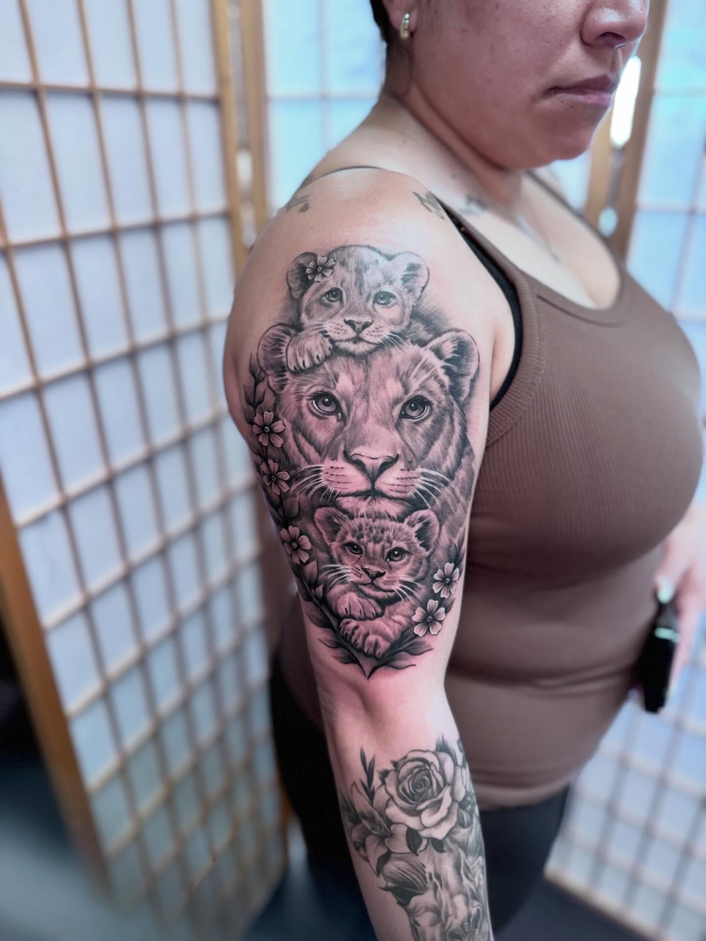Lion family realism tattoo on the shoulder by Tattoos By Chico