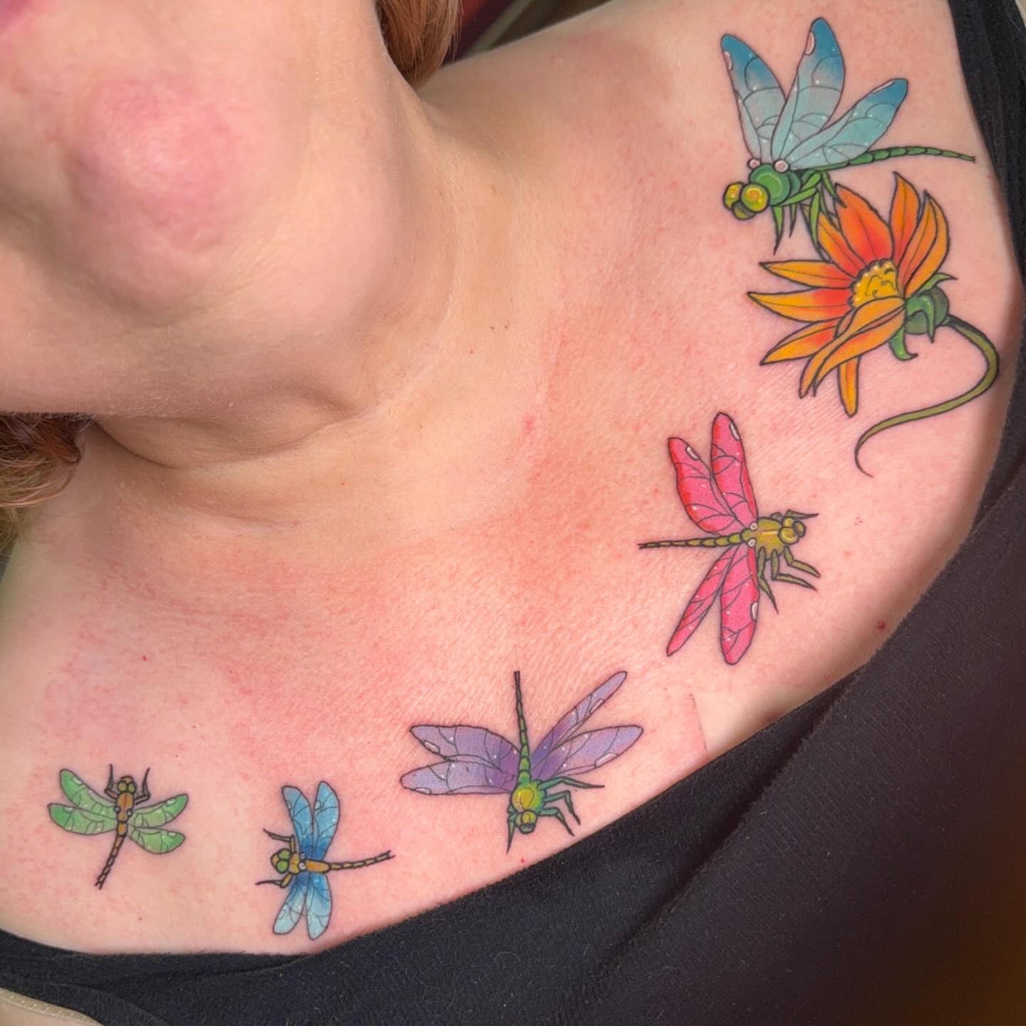Dragonflies and flowers new school tattoo on the shoulder by Erin McDavis