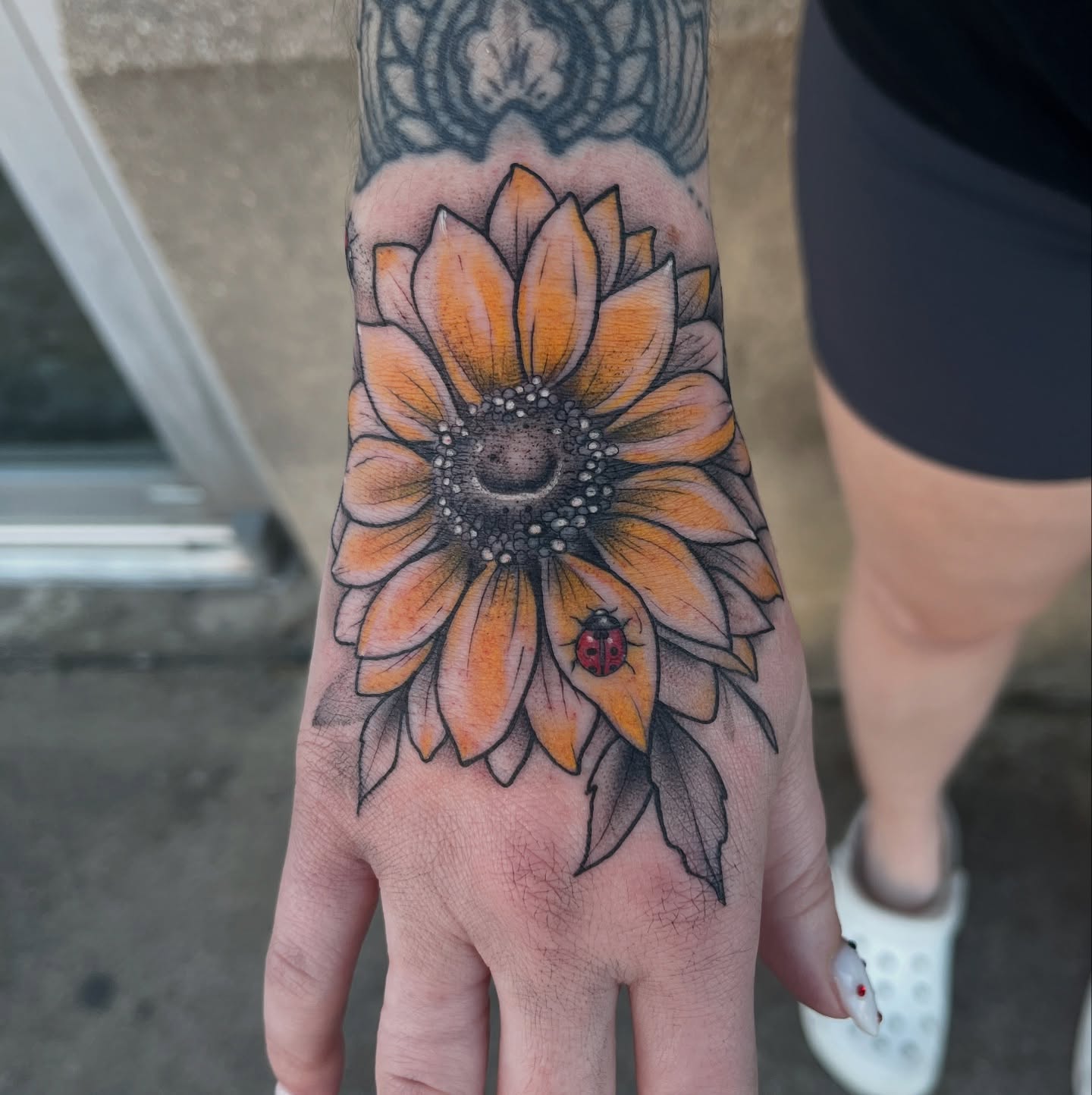 Sunflower realism tattoo on the hand by Timmy
