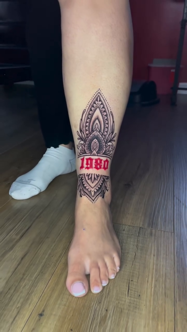 Mandala with '1980' text ornamental tattoo on the calf by Inkman Parson
