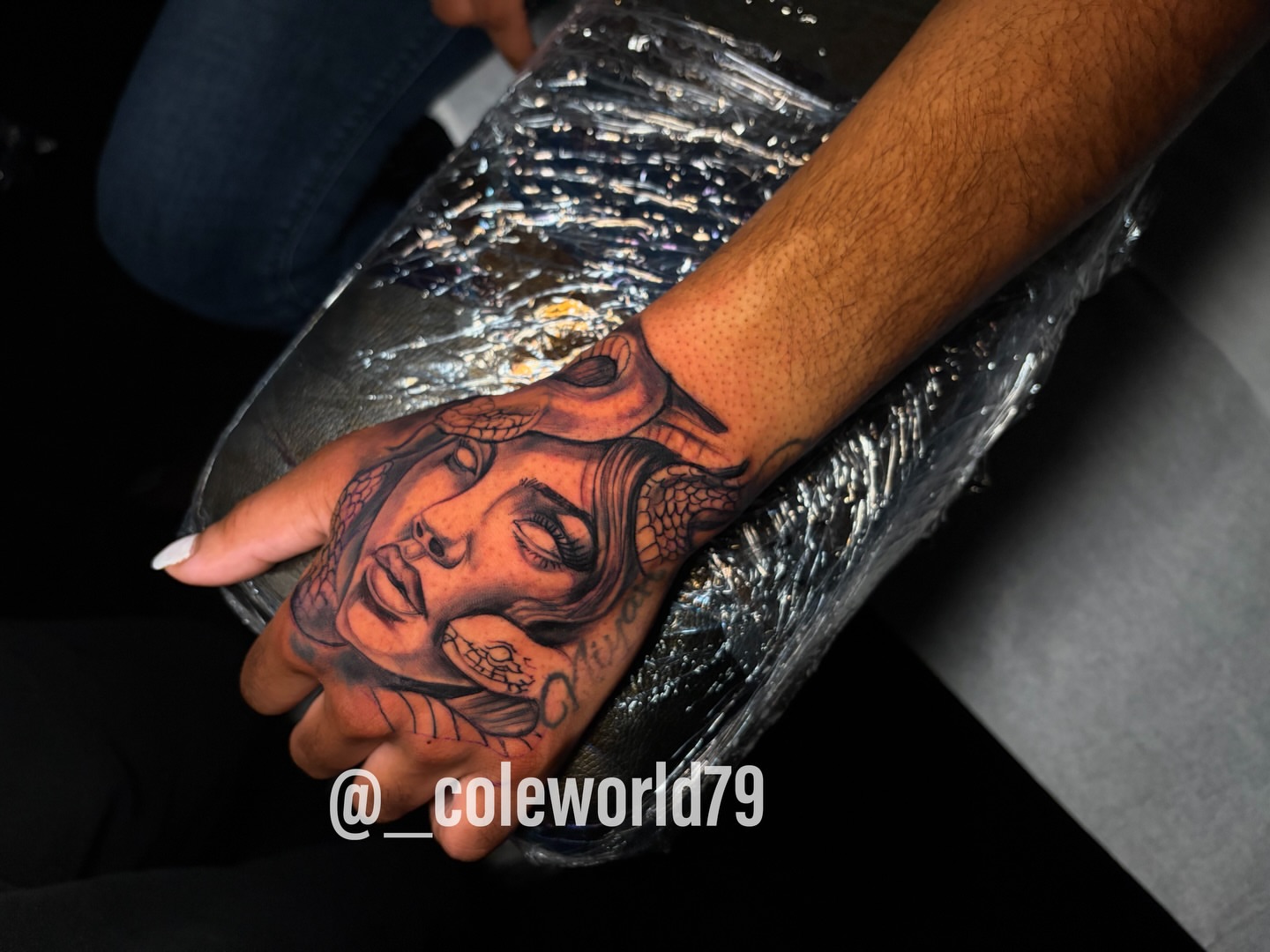 Woman's face realism tattoo on the hand by Chicago tattoo artist