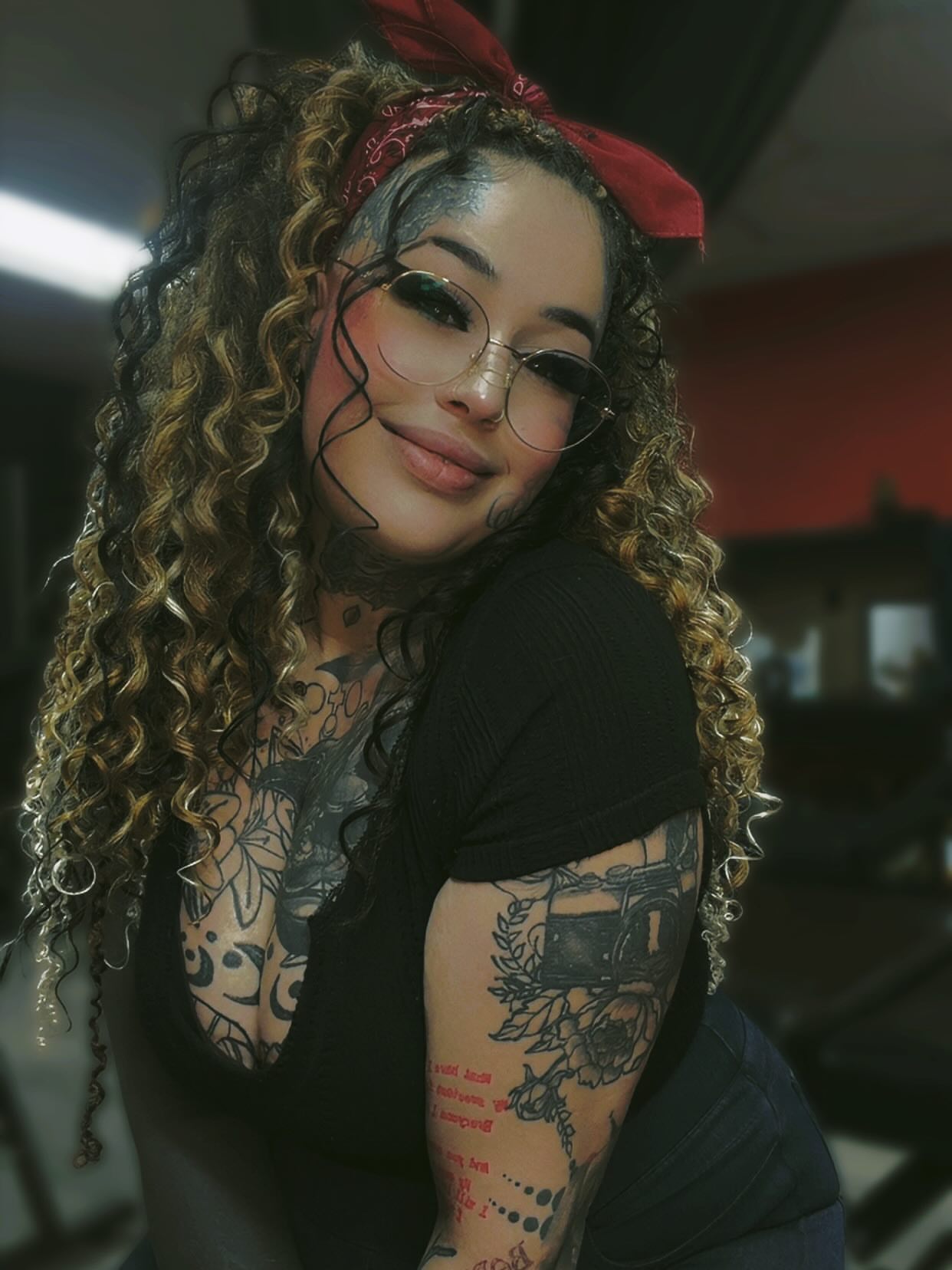 Floral and mechanical black and grey tattoo on the upper arm by Jamie Jane Voryer