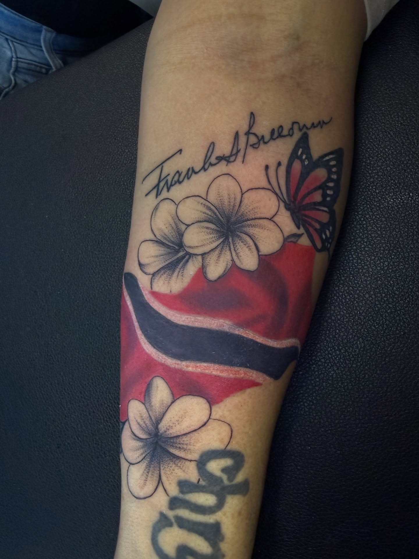 Flowers and butterfly dotwork tattoo on the forearm by Butta