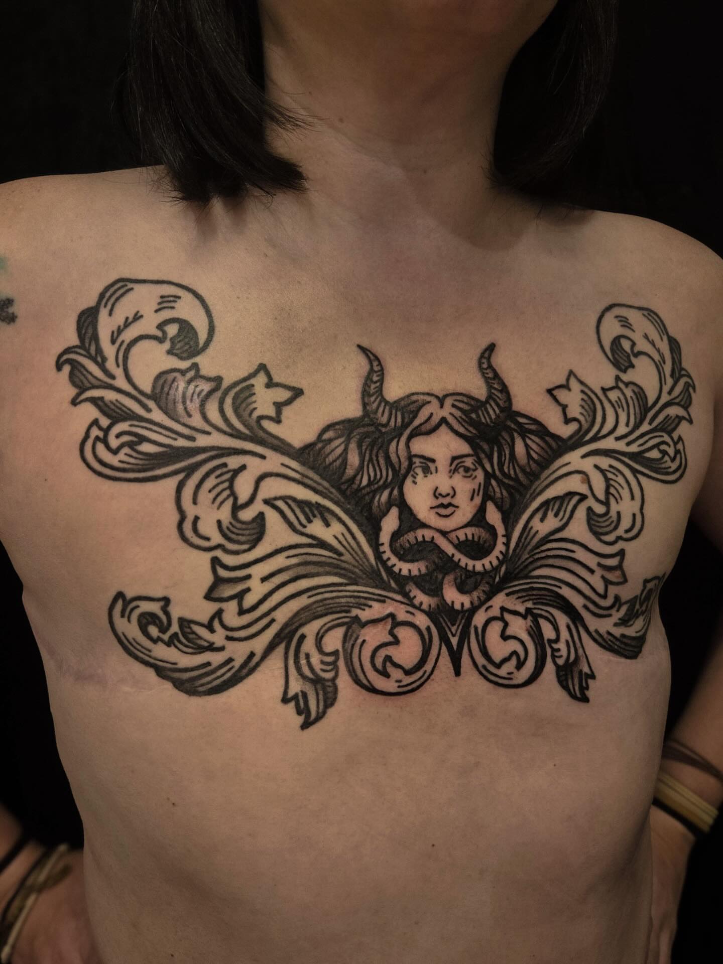 Medusa ornamental tattoo on the chest by ashley blyght