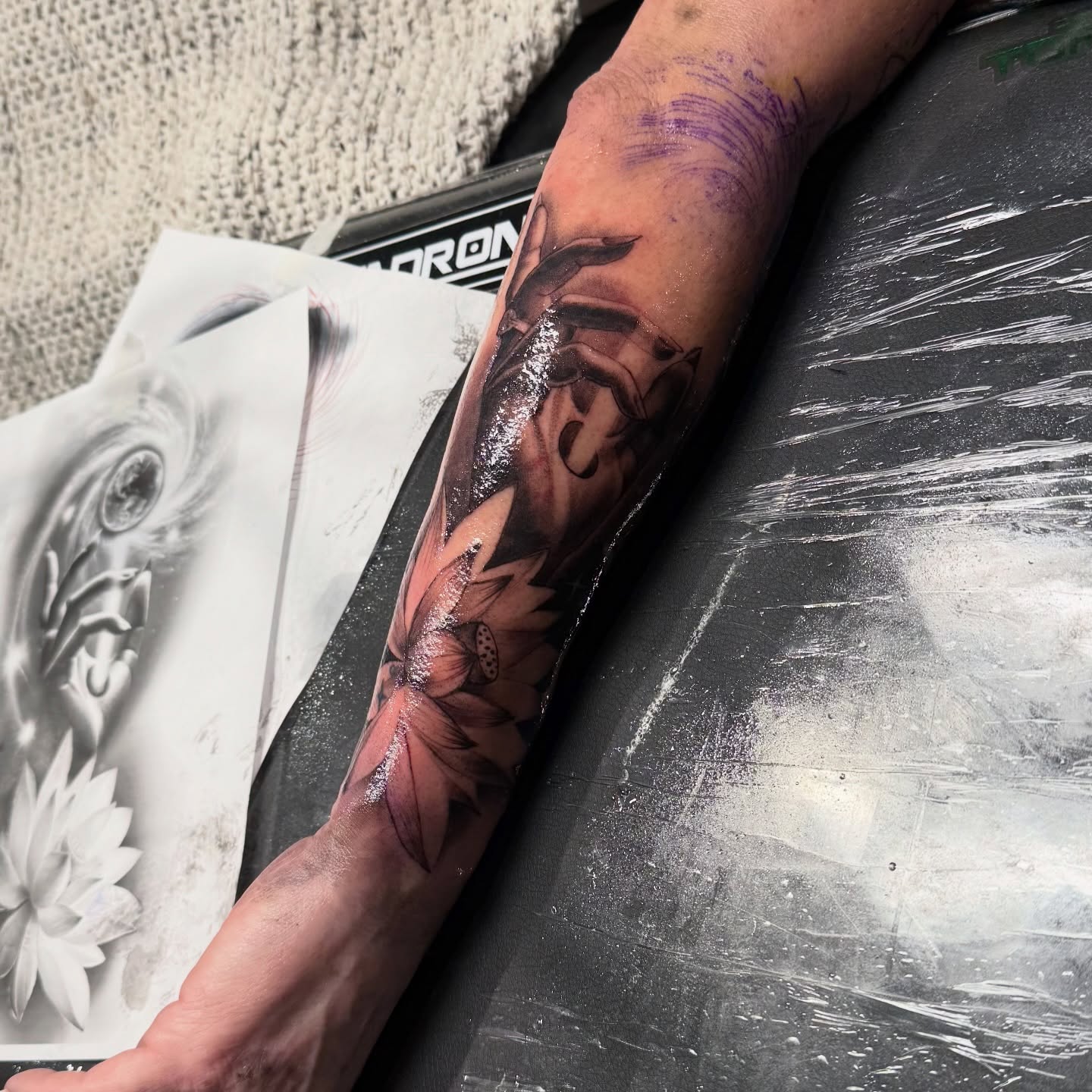 Flower and butterfly realism tattoo on the forearm by Grace P
