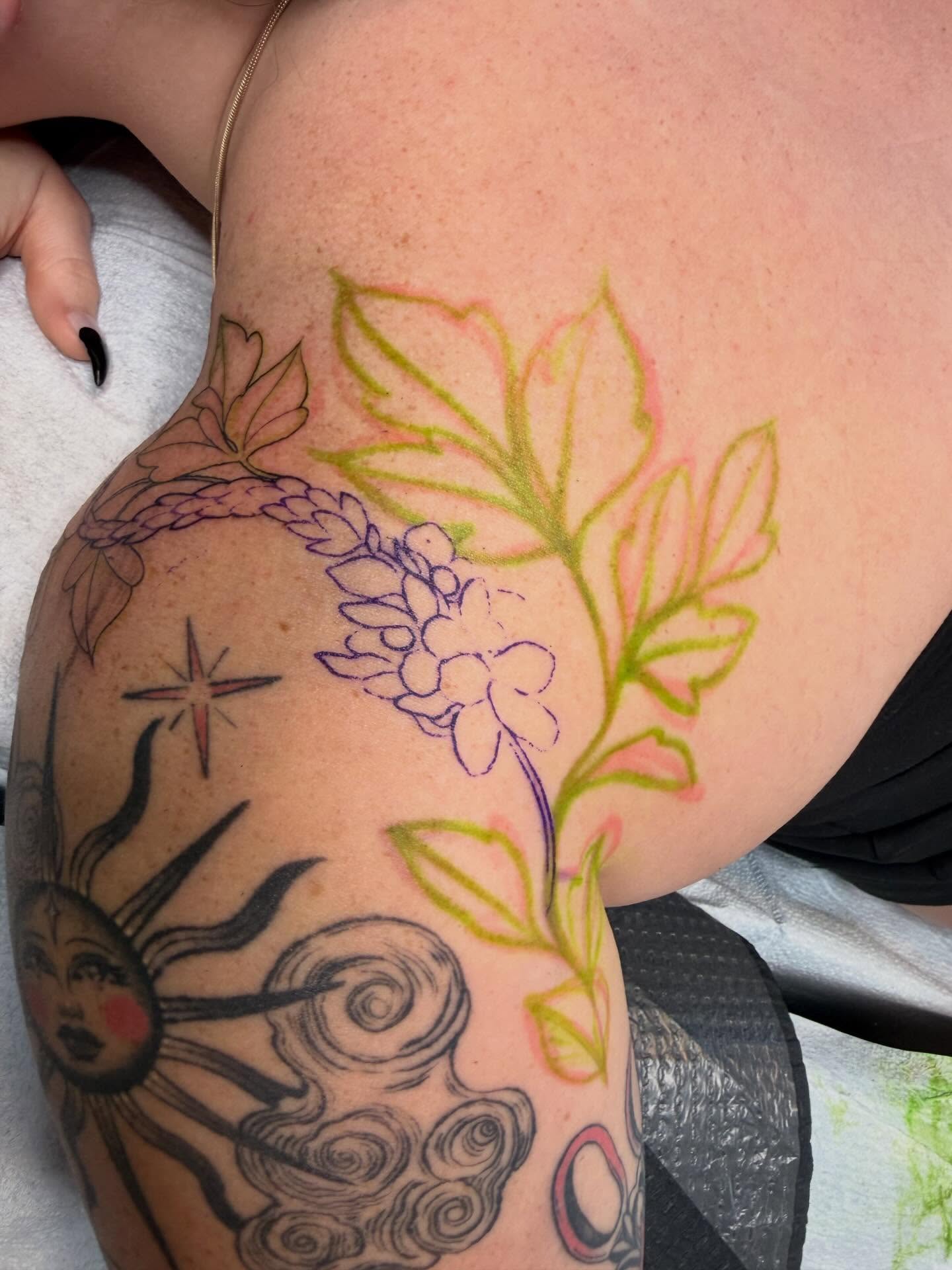 Flower and braid new school tattoo on the thigh by Reagan Mauldin