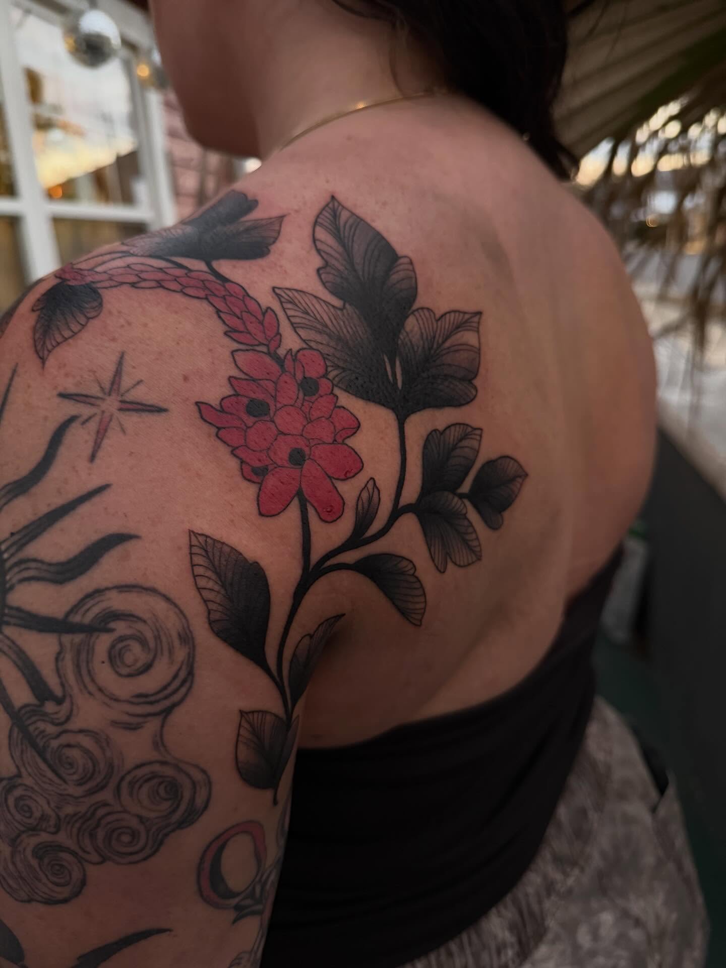 Flower and leaves black and grey tattoo on the shoulder by Reagan Mauldin