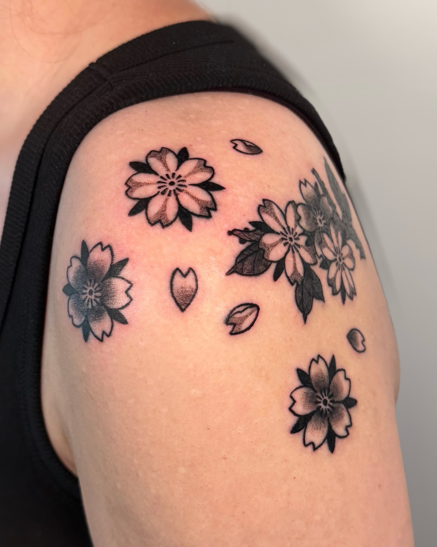 Cherry blossoms black and grey tattoo on the shoulder by binh