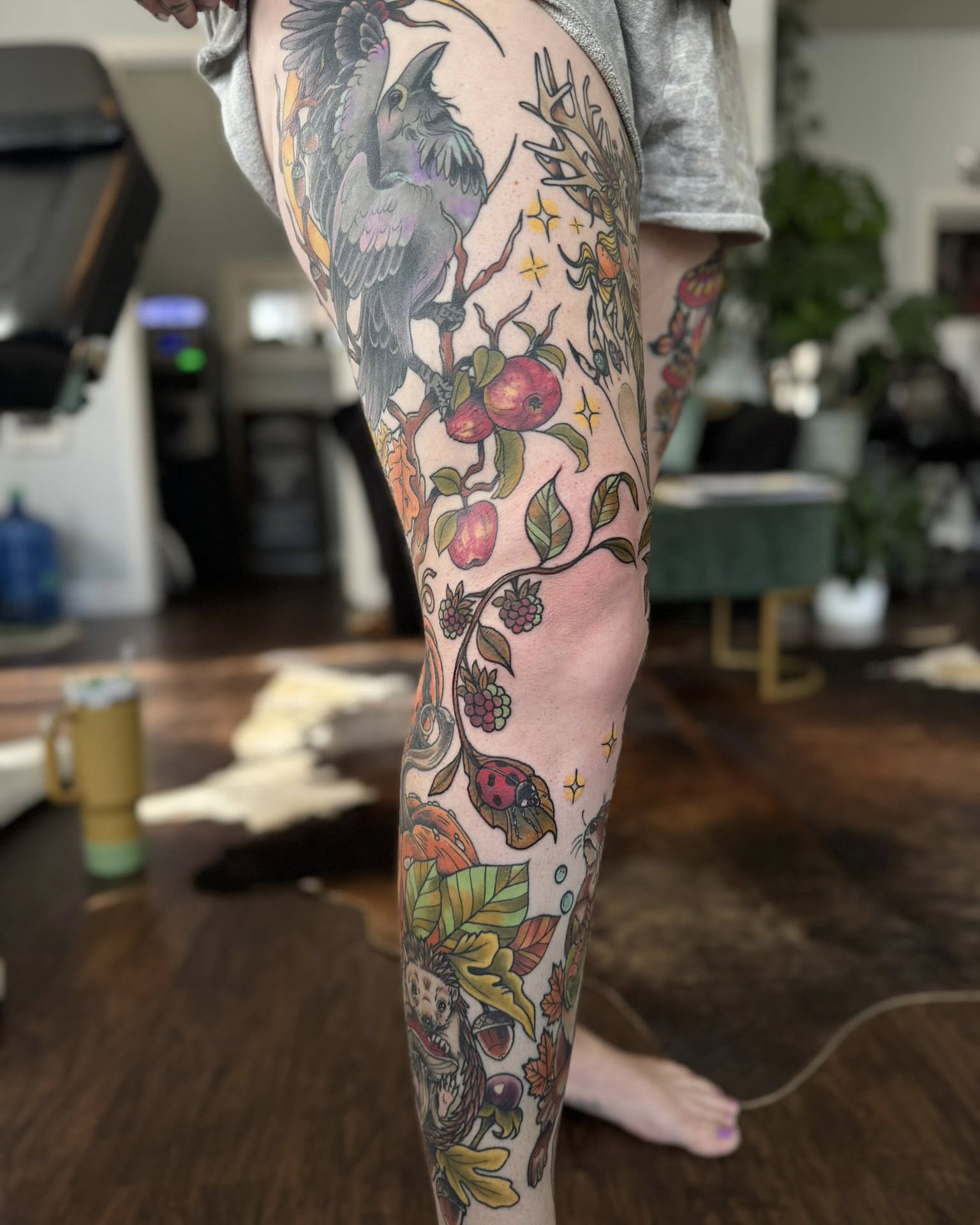 Bird and botanical new school tattoo on the thigh by Eden Rose, Kalama, Washington