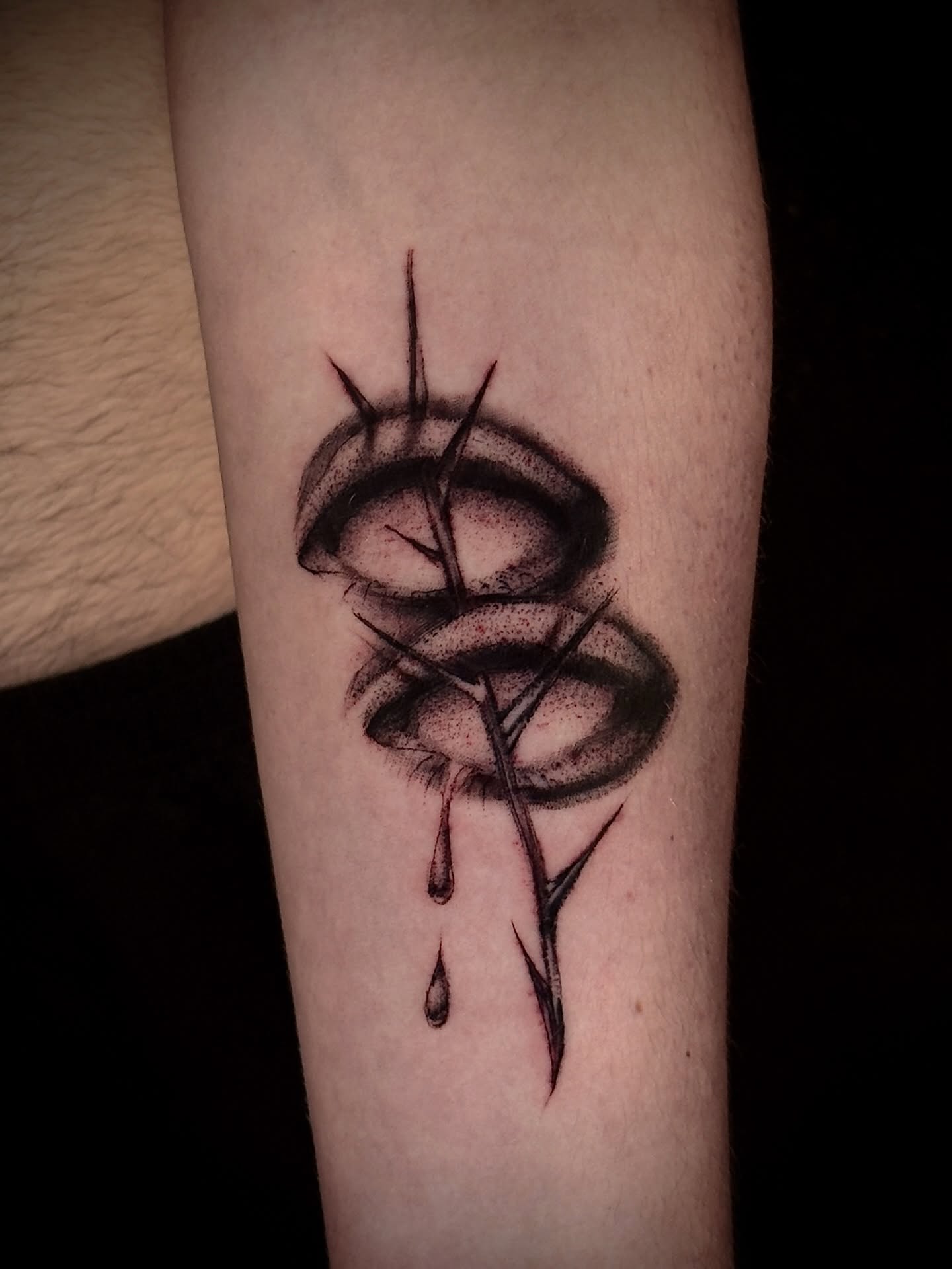 Abstract design dotwork tattoo on the forearm by Thomas Martinez
