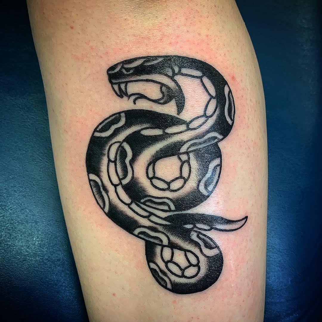 Snake American traditional tattoo on the thigh by Tattoos Las Vegas,NV