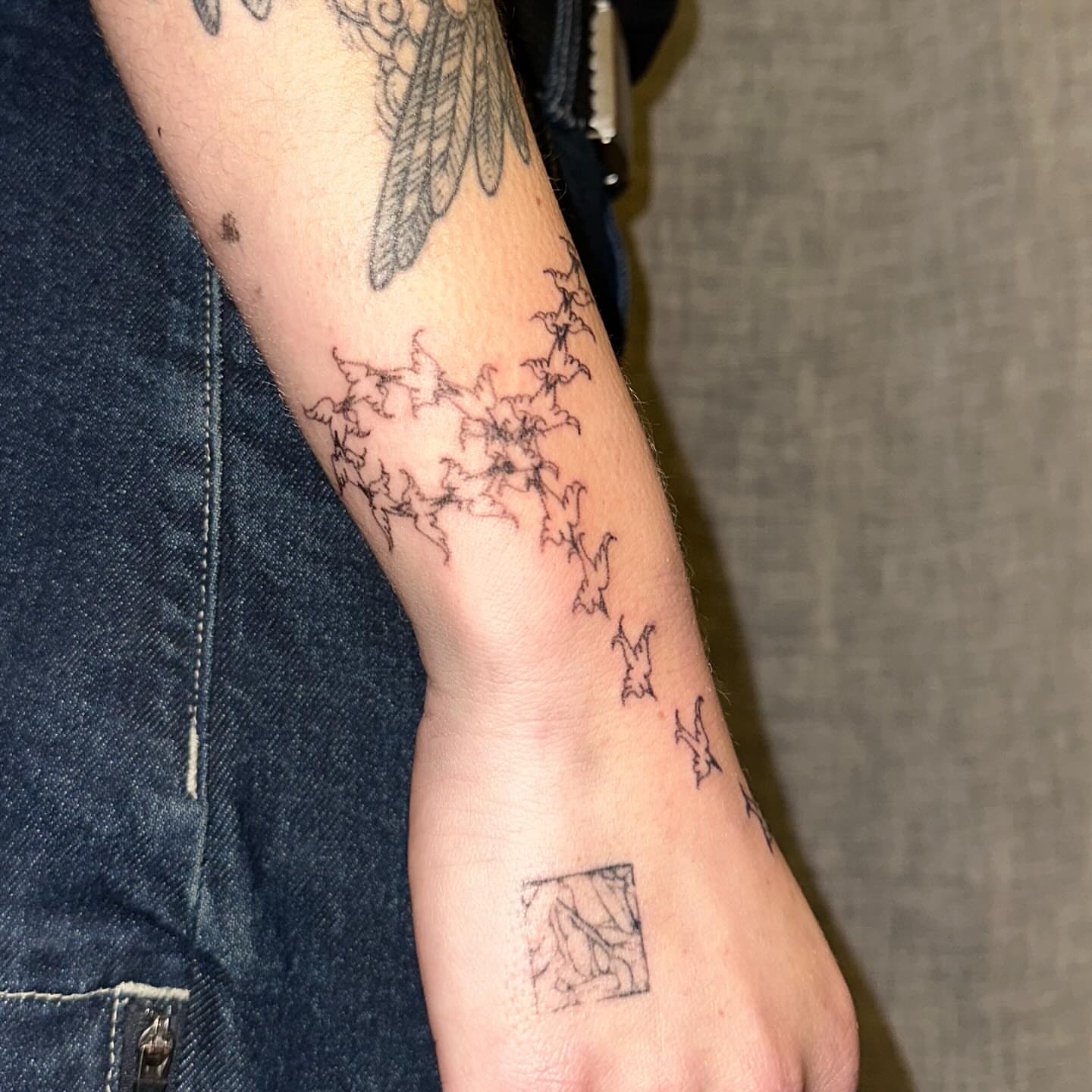 Bat swarm black and grey tattoo on the forearm by kate