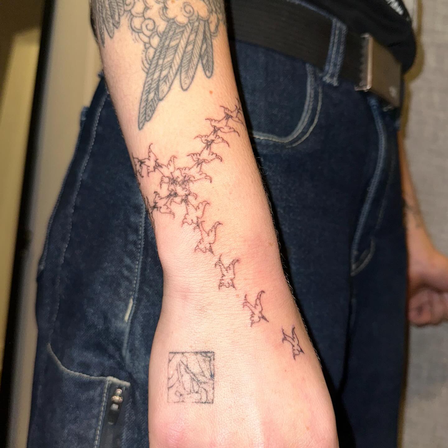 Birds and floral dotwork tattoo on the forearm by kate