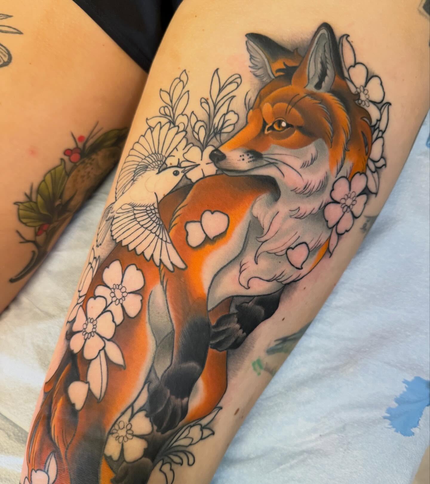 Fox and bird American traditional tattoo on the thigh by Kyle Behr