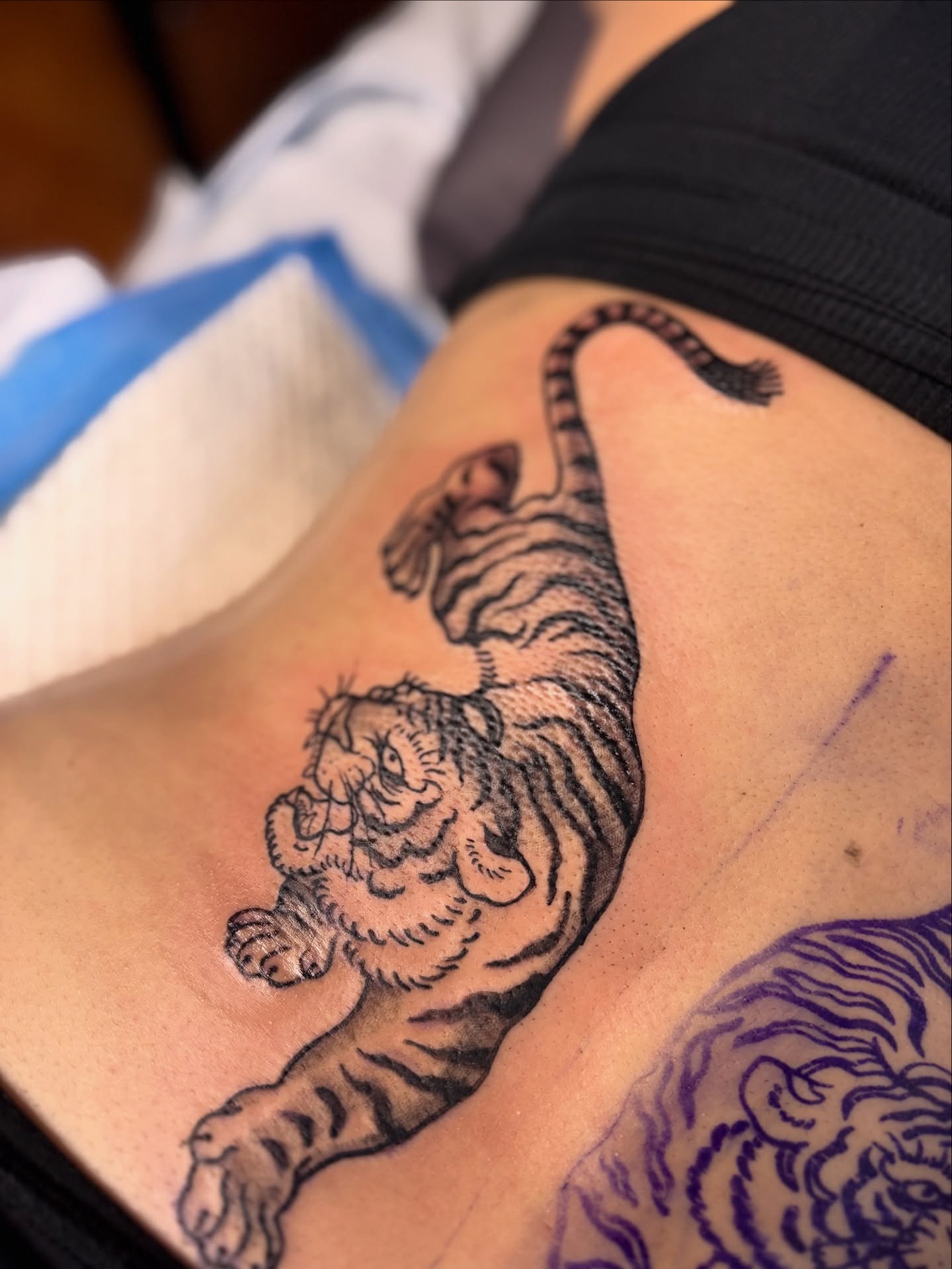 Tiger black and grey tattoo on the ribs by Kelly Von Tattoos, Saxapahaw, North Carolina