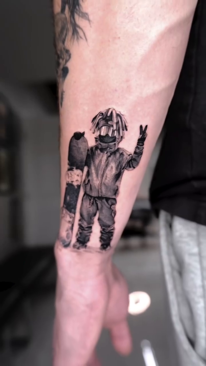 Character with skateboard realism tattoo by Bay Area Tattoo Artist