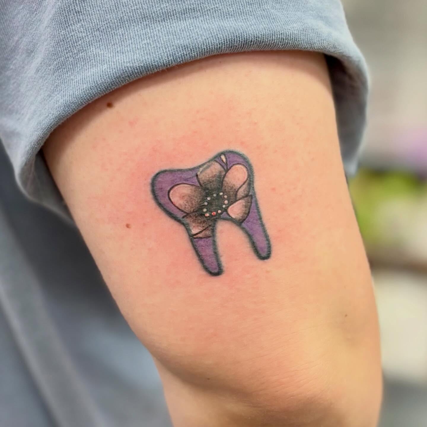 Tooth dotwork tattoo on the forearm by bradyn thornton: eco-tattoo artist