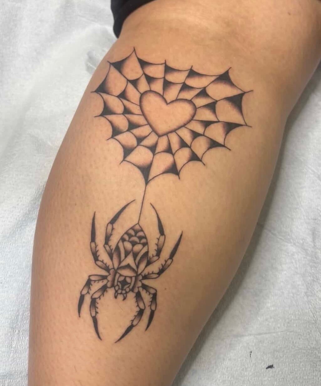 Spider web with heart geometric tattoo on the thigh by Erika Donn, Portland, Oregon