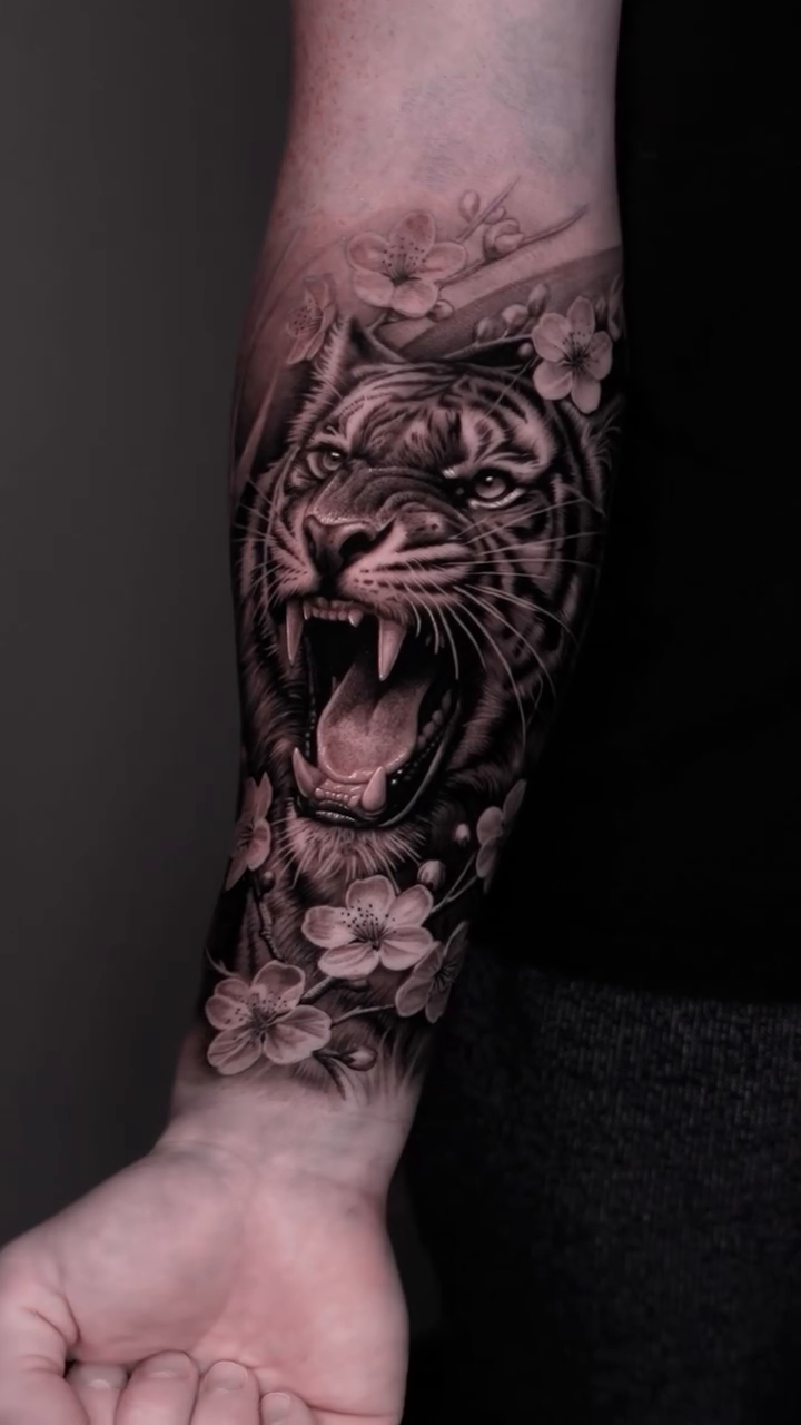 Tiger with flowers realism tattoo by Steven tattoo