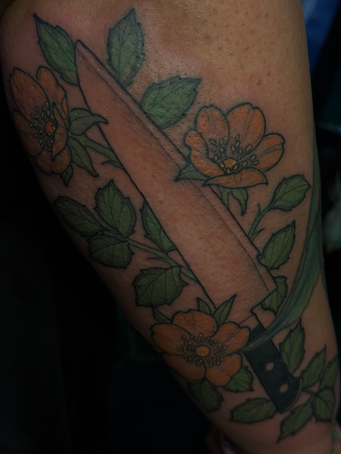 Knife and flowers American traditional tattoo on the forearm by jess jené jones, Portland, Oregon