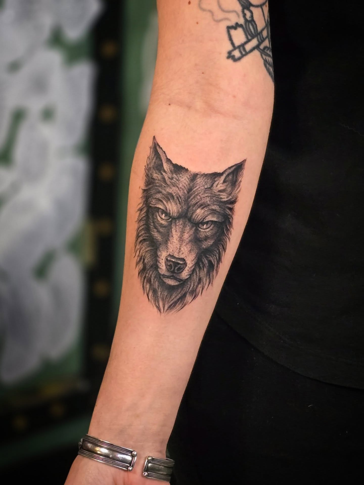 Wolf realism tattoo on the forearm by Aaron Dor