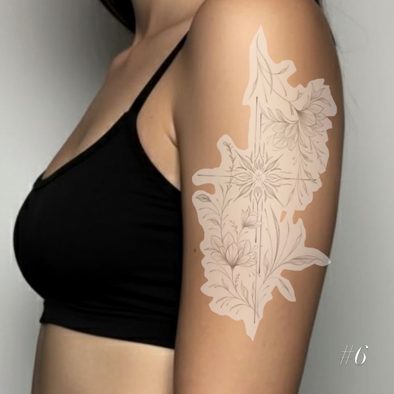 Floral cross fine line tattoo on the thigh by @tattoosbyskyeee