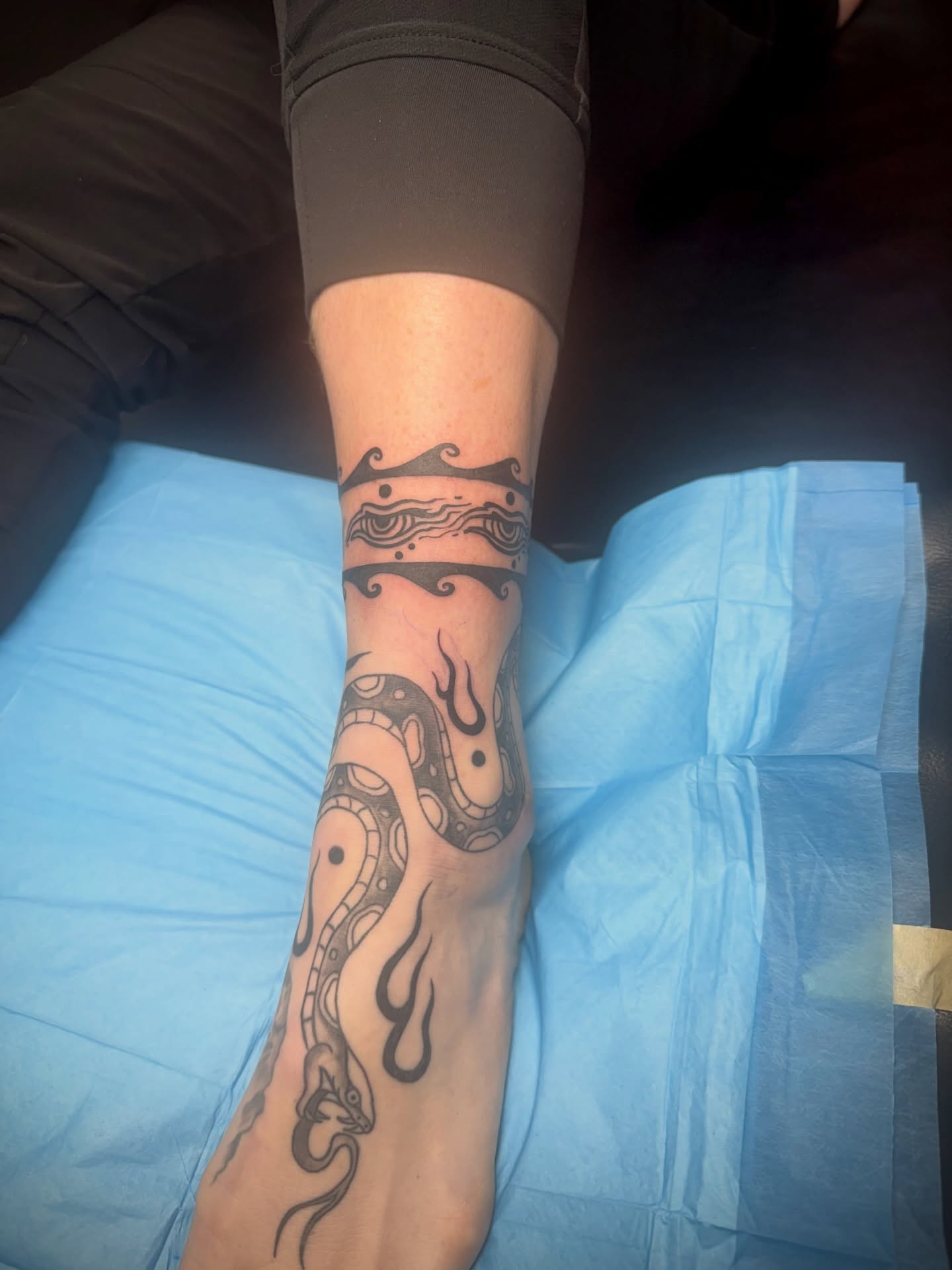 Snake black and grey tattoo on the forearm by Kylie Allen