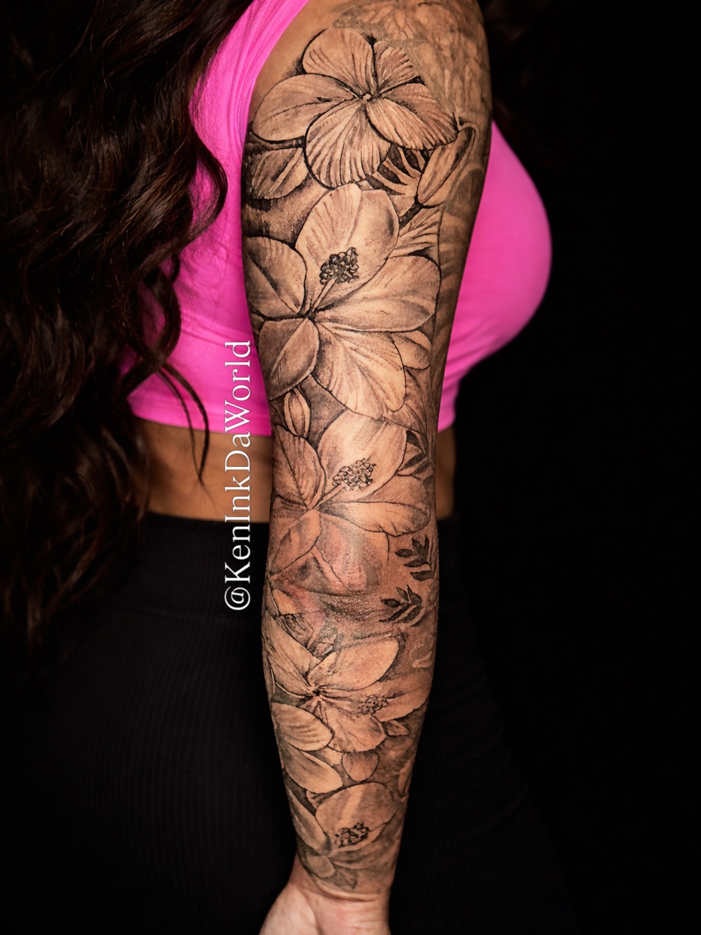 Floral arrangement realism tattoo on the forearm by Ken West