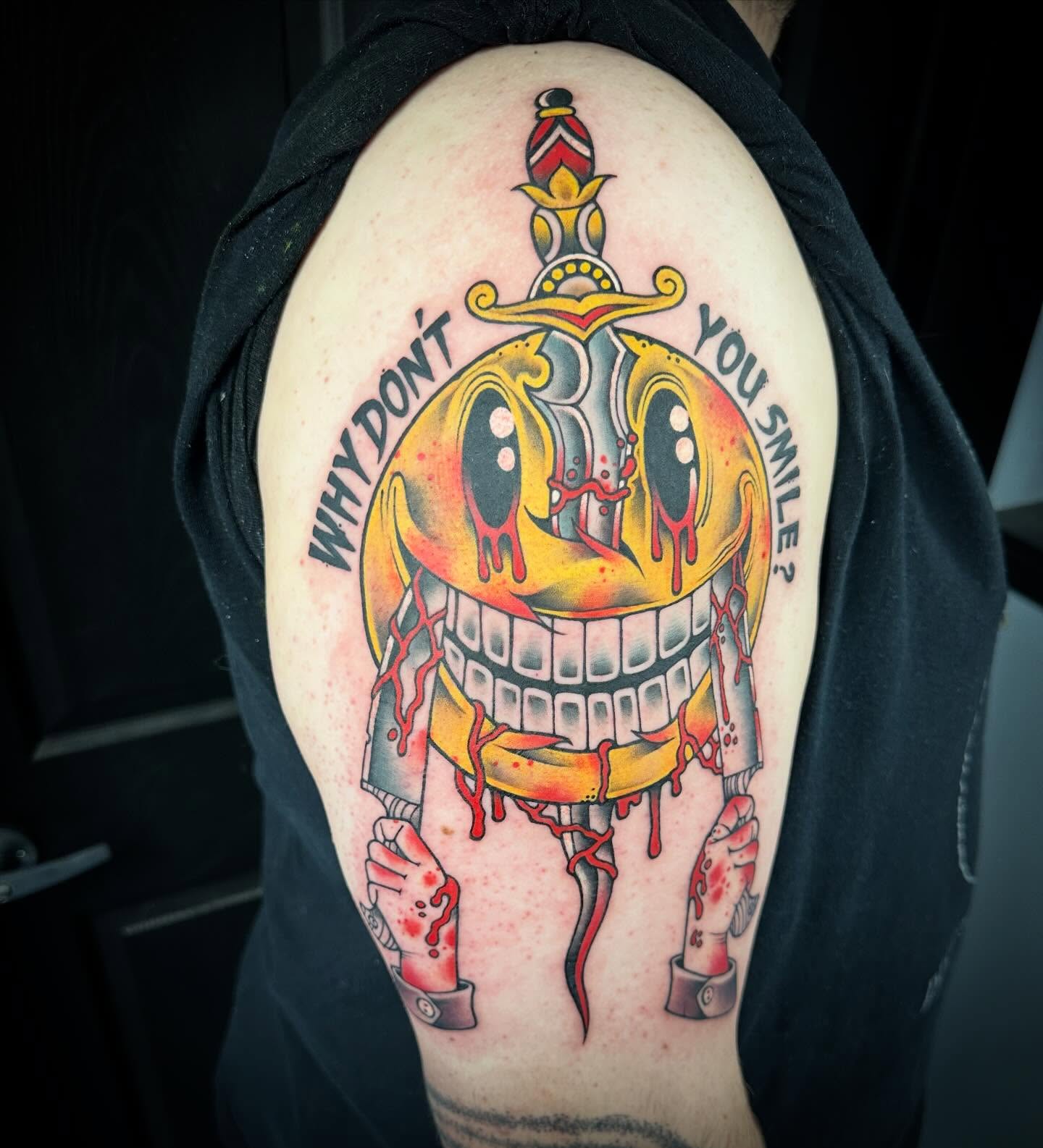 Smiling robot head American traditional tattoo on the shoulder by Mark Boller
