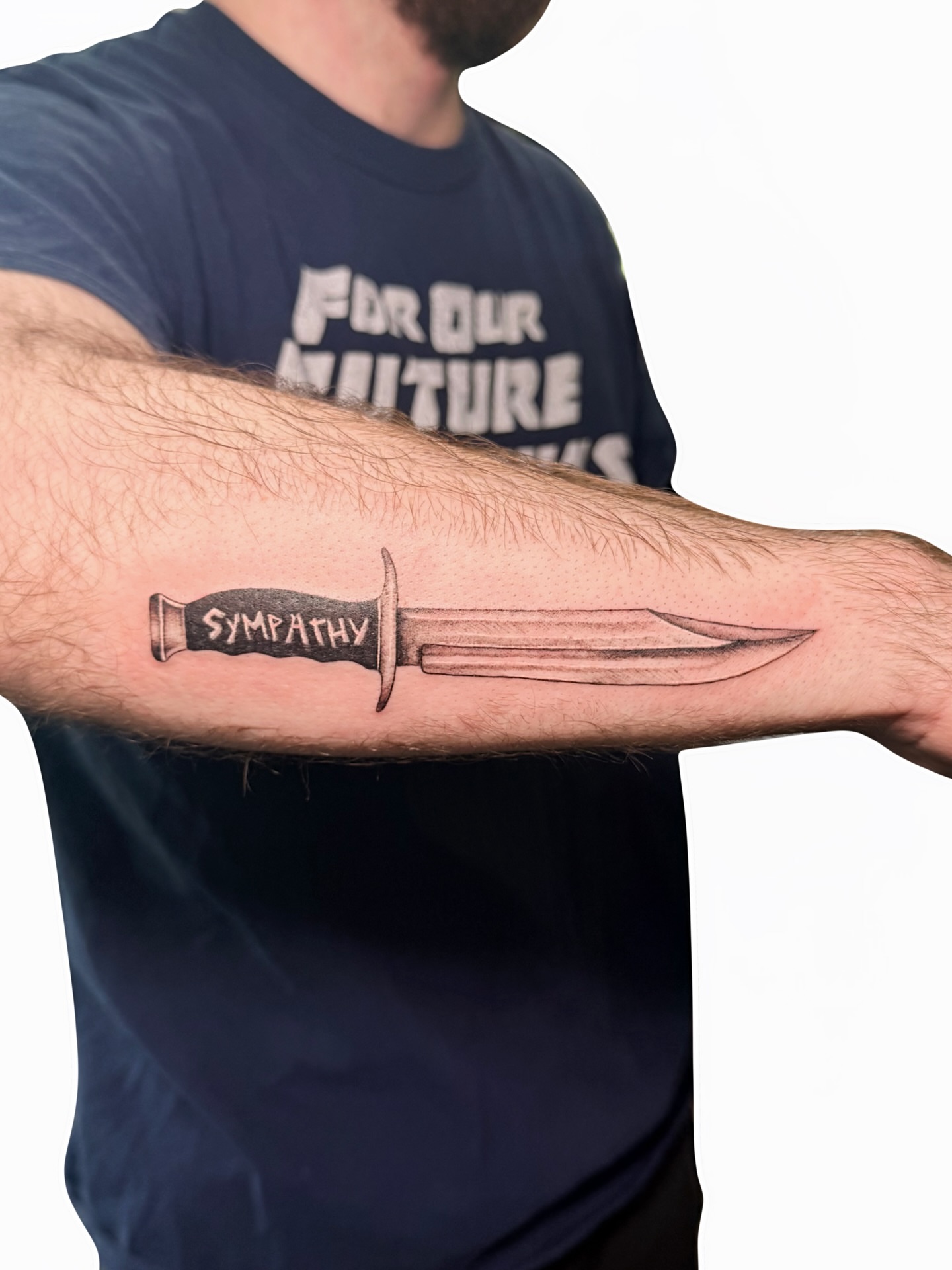 Knife black and grey tattoo on the forearm by Fionna, Seattle, Washington