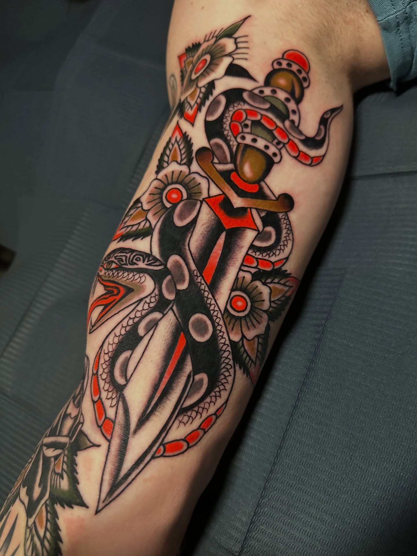 Snake and dagger American traditional tattoo on the forearm by A.j. Lingerfeldt, Nashville, Tennessee