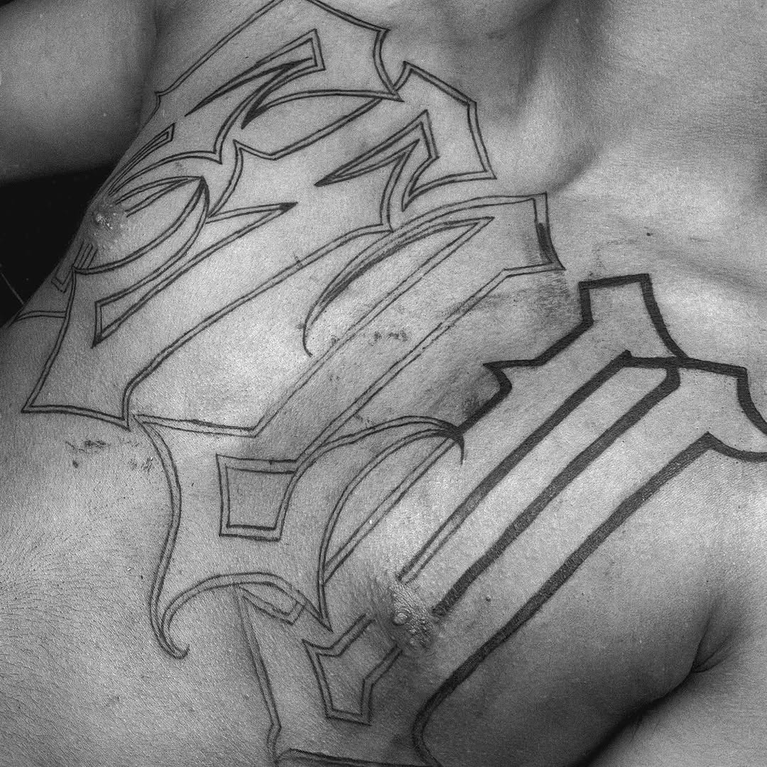 Script lettering Chicano tattoo on the chest by Come Get Blasted By Chula💥