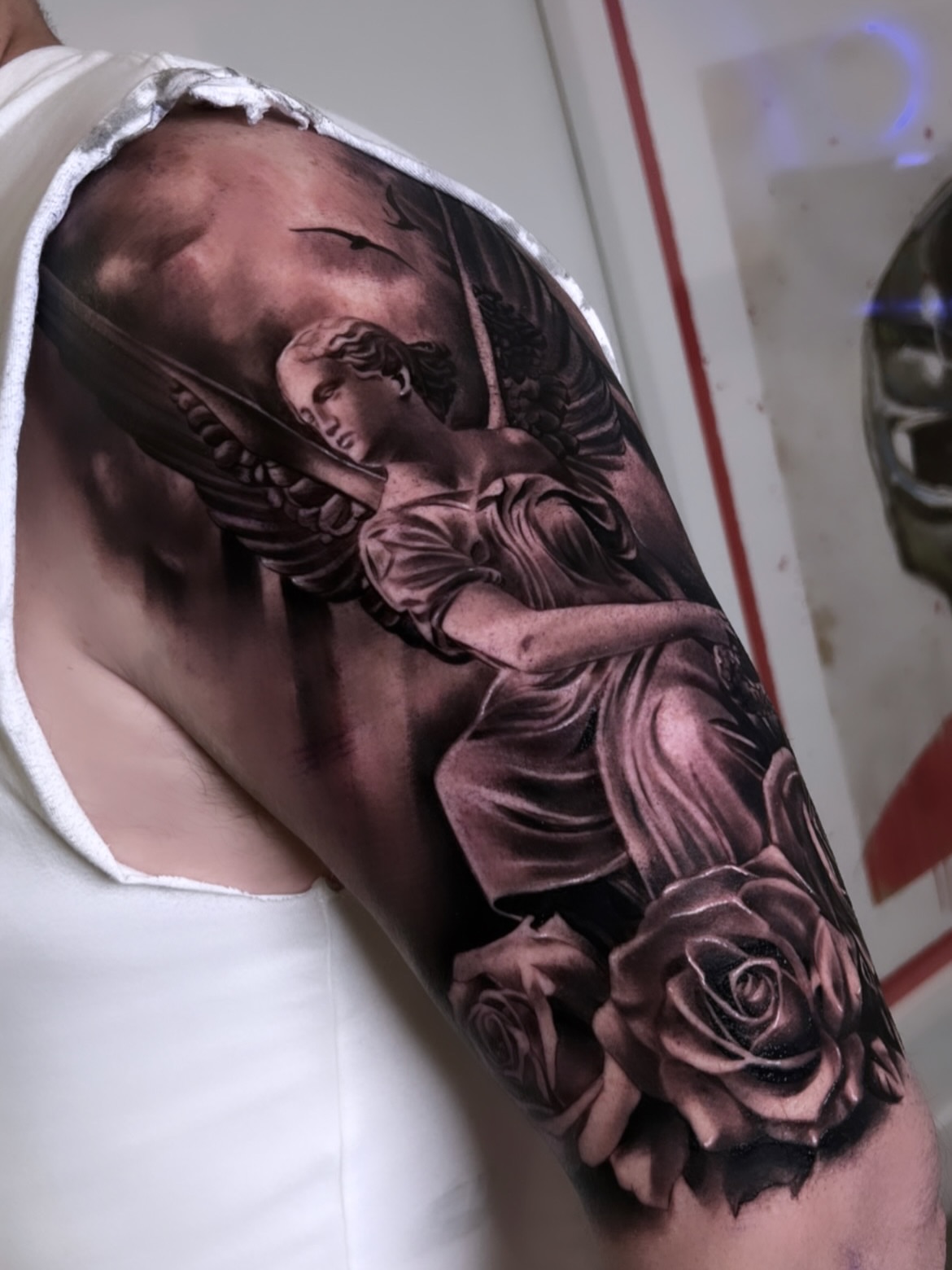 Statue of woman with roses realism tattoo on the forearm by Yudel