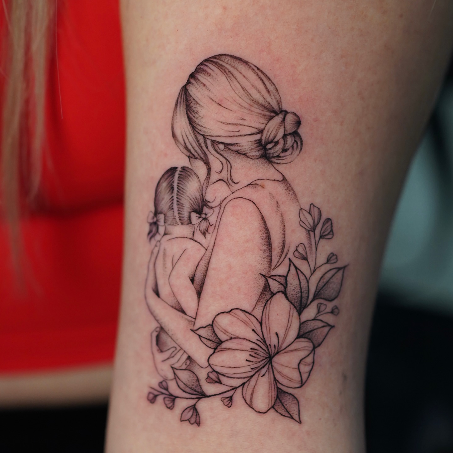 Mother and child realism tattoo on the forearm by Jess Dominguez