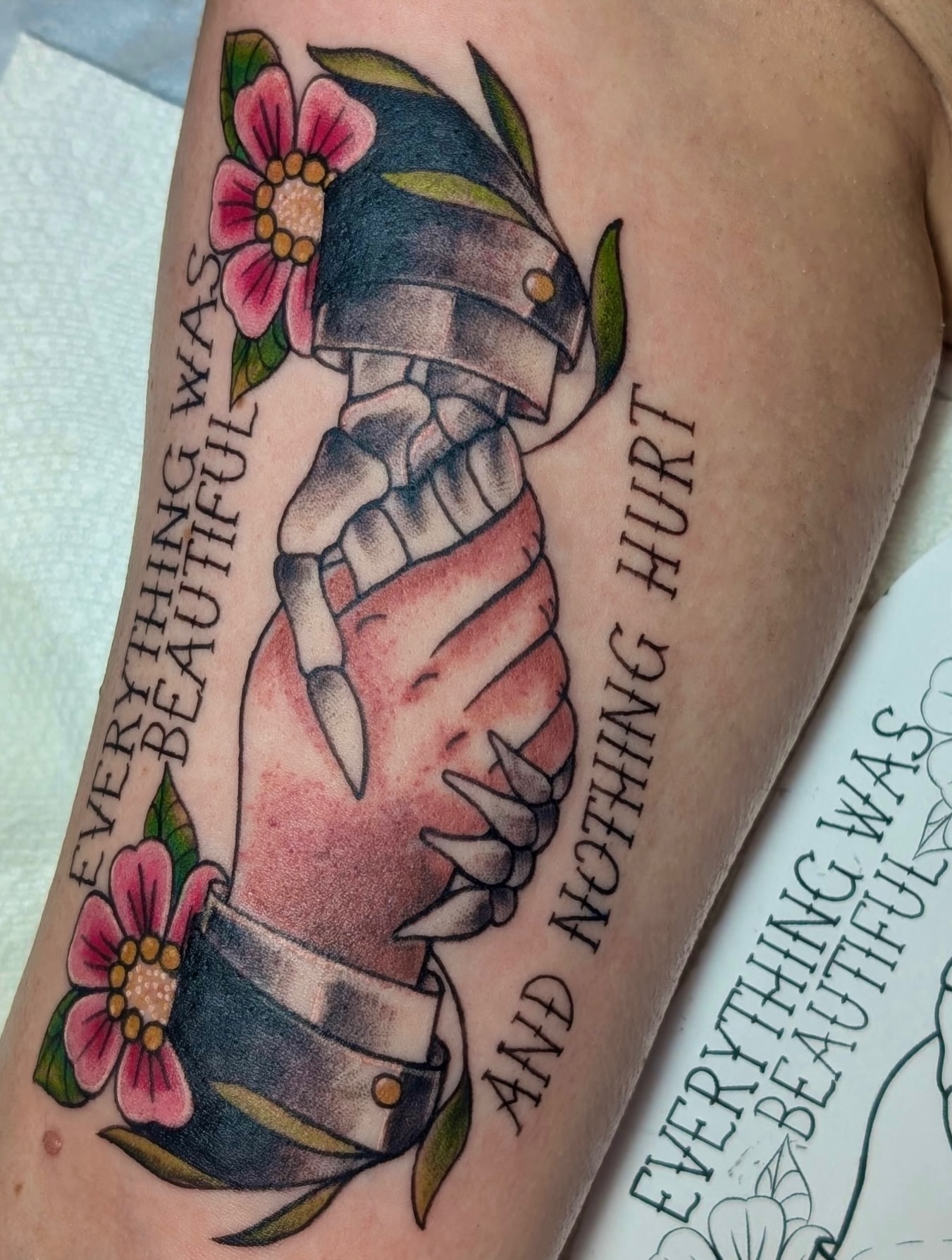 Skeleton hand with flowers American traditional tattoo on the forearm by Kelly Von Tattoos, Saxapahaw, North Carolina