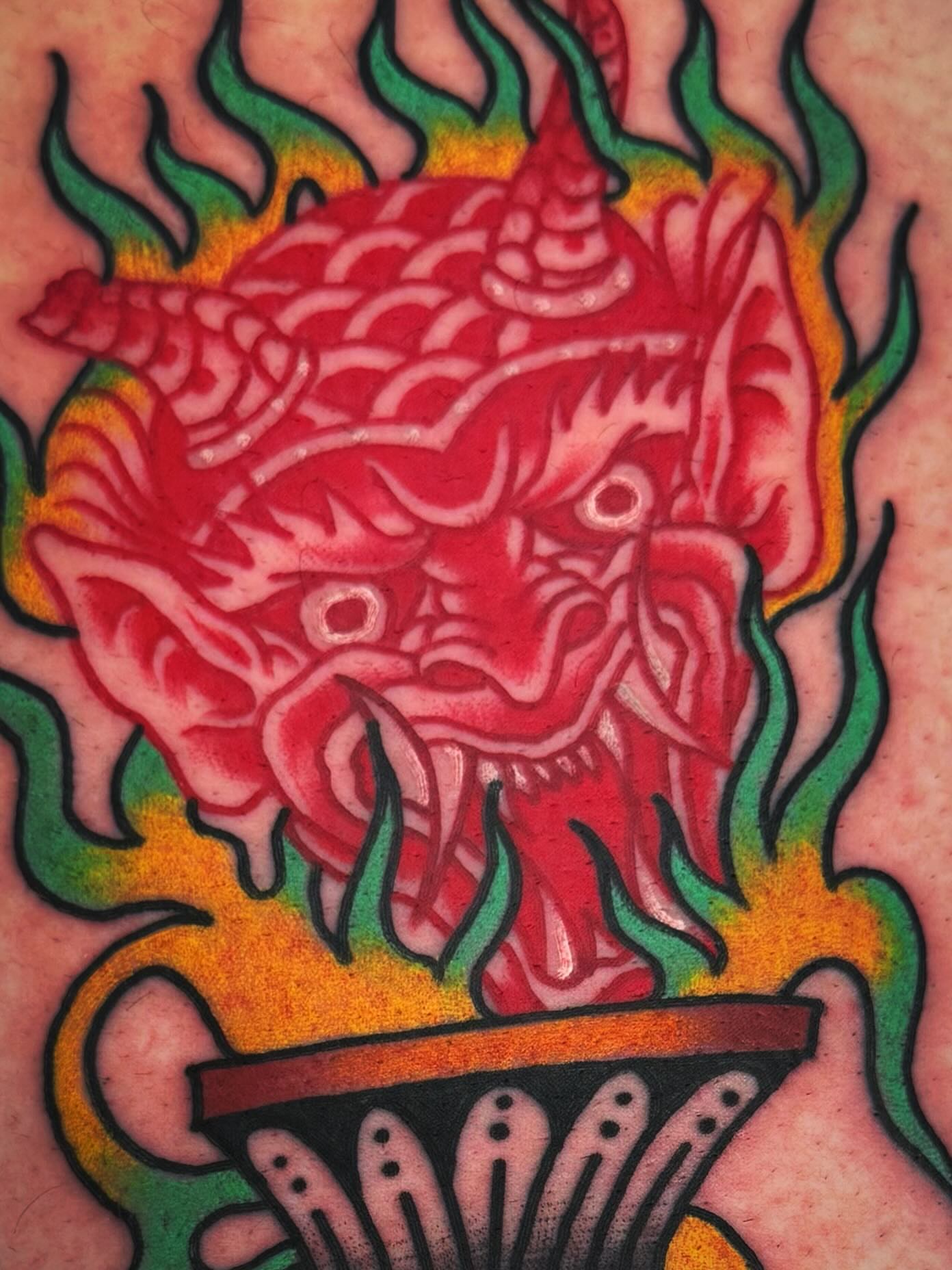 Demon head American traditional tattoo on the forearm by Mikey Sarratt