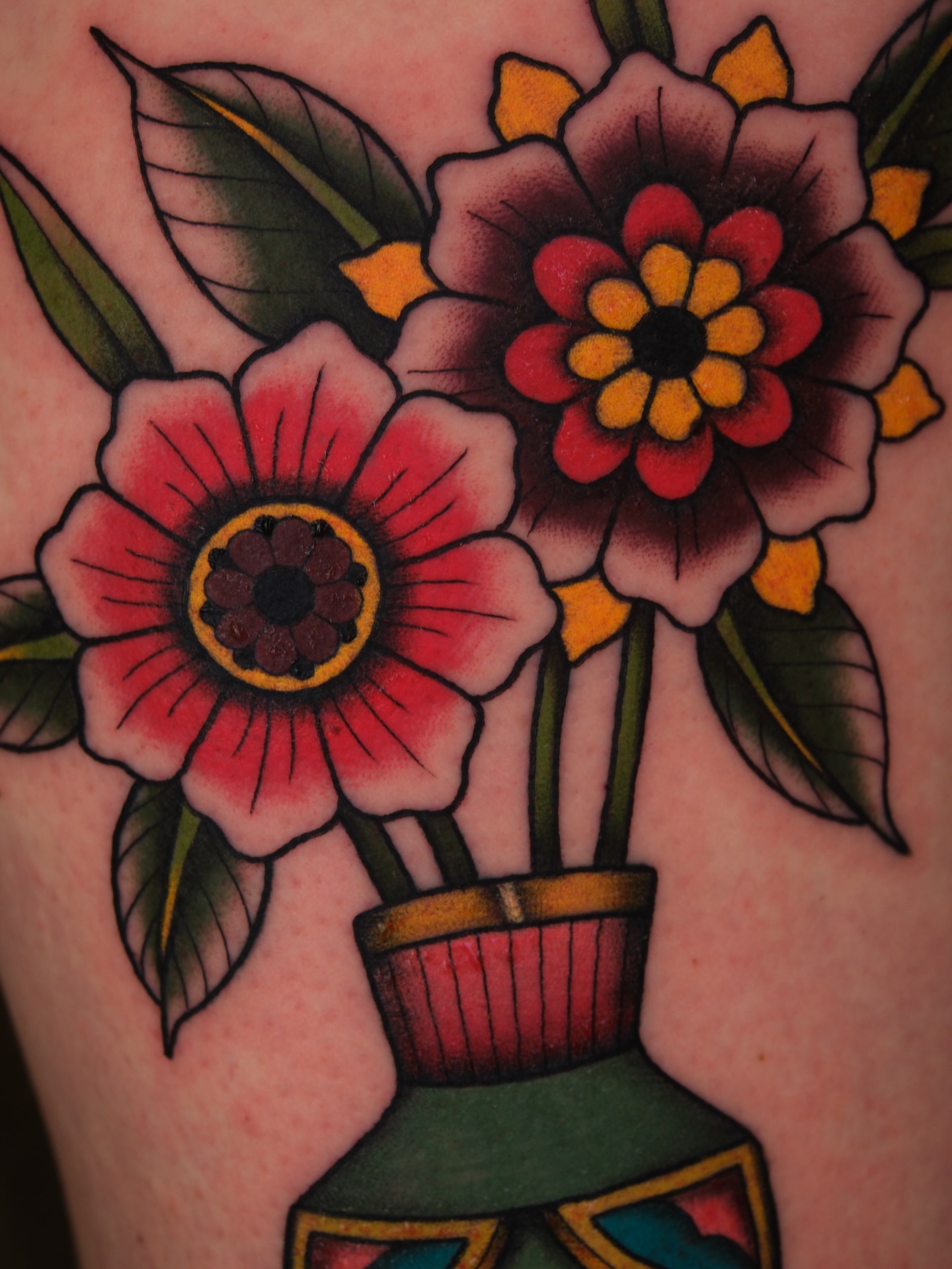 Flowers in vase American traditional tattoo on the upper arm by Mallory Murphy, Denton, Texas
